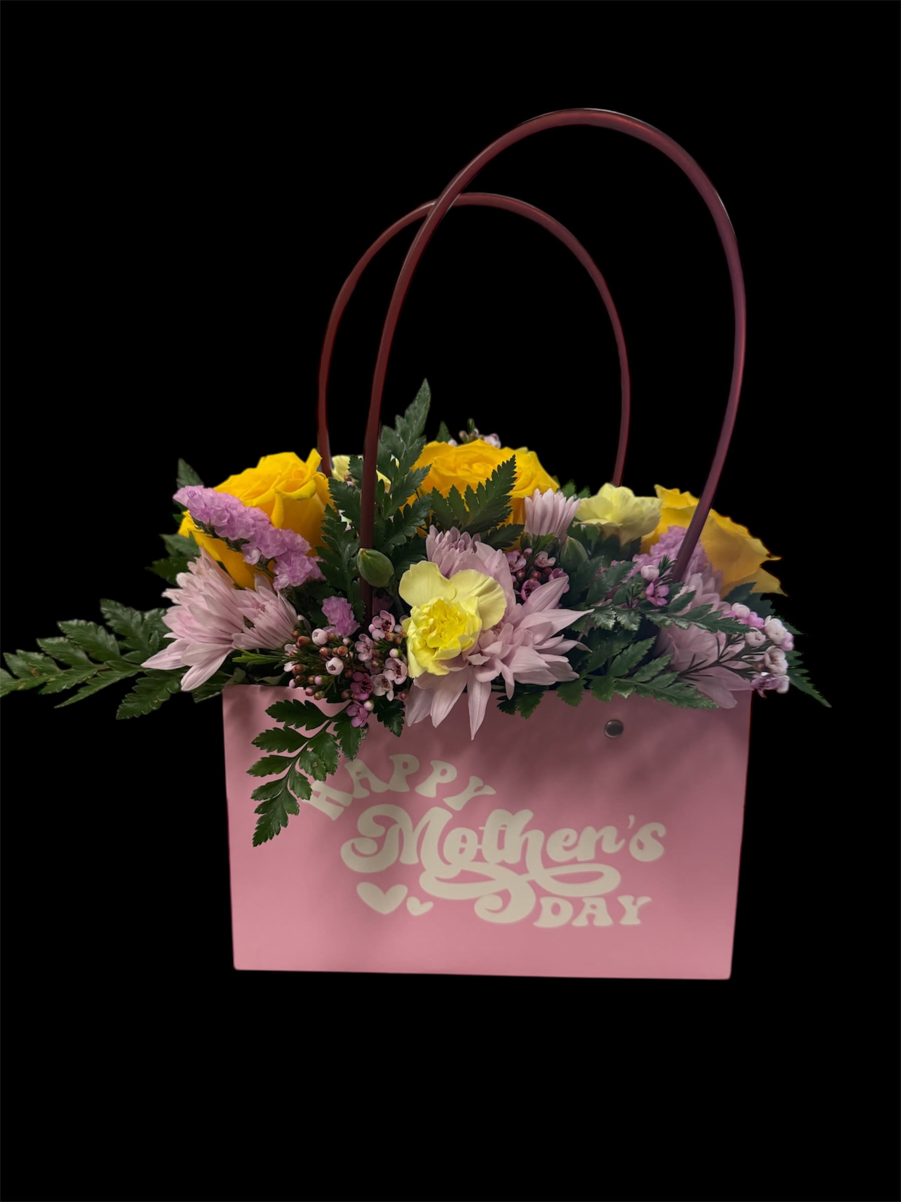 Petals and Pearls - Fresh blooms artfully arranged in an adorable pocketbook.   Due to disruptions in the global supply chain, we may have to make substitutions to your selected design. As always, it will be beautiful! We will substitute plants for plants and fresh flowers for fresh floral selections.