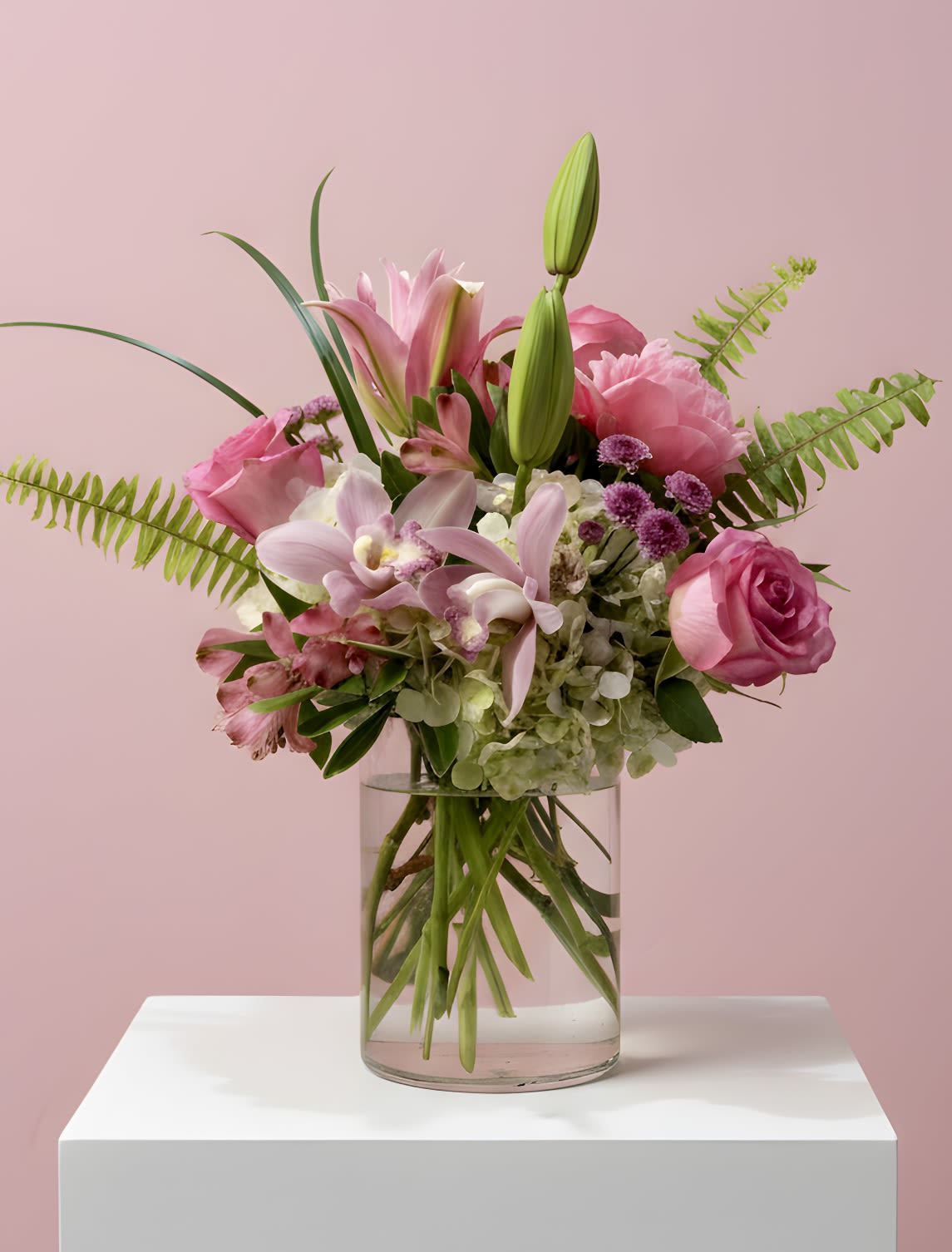 Butterfly Garden  - A light, airy arrangement designed with graceful movement and soft texture. Layered blooms in varying shapes create a floating, effortless feel, complemented by delicate accents and lush greenery. Refined yet natural, it brings a fresh, modern presence—perfect for any occasion.