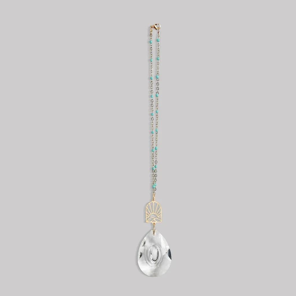 Beaded hanging ornament with gold accent and clear teardrop crystal pendant