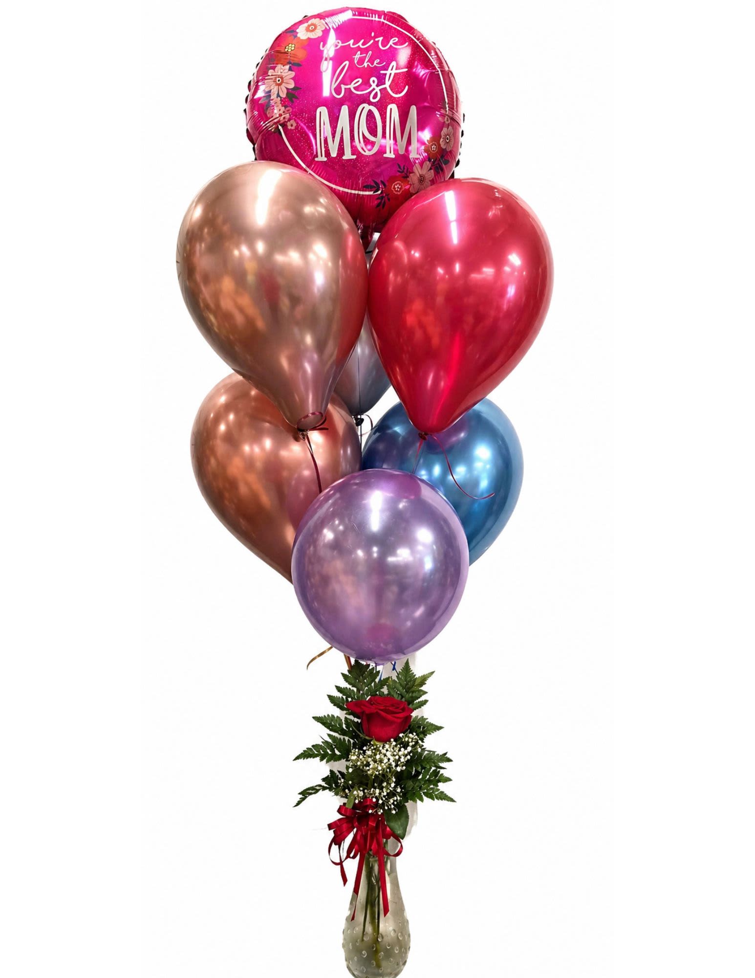 Loving Mama  - A glossy pink foil balloon declaring "You're the best MOM" takes center stage in this loving Mother's Day flower arrangement, making it an unmistakable pick for Mother's Day or any occasion when you want to celebrate a special mom. The balloon cluster-rose gold, red, purple, and blue metallic latex-adds instant party energy while keeping the focus on the thoughtful message, so the person you're honoring will feel recognized and loved the moment they see it.  Beneath the balloons, a single red rose is nestled into fresh greenery with delicate white filler flowers, arranged in a textured glass vase and finished with a red ribbon for a polished, heartfelt look. The combination of classic rose romance and bright, celebratory balloons balances sentiment and joy-perfect for a mom who appreciates both elegance and fun.  Send this to show appreciation on Mother's Day, a birthday, or "just because" when you want her to feel truly seen. Vase-ready and delivered complete with balloons and ribbon, it arrives ready to display; replace the water every couple of days and keep out of direct sunlight to extend the life of the fresh flowers.