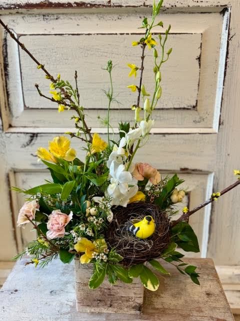 Nature Lover - A 5" birch bark box holds an assortment of seasonal blooms, branches, foliage and a nest with bird. 