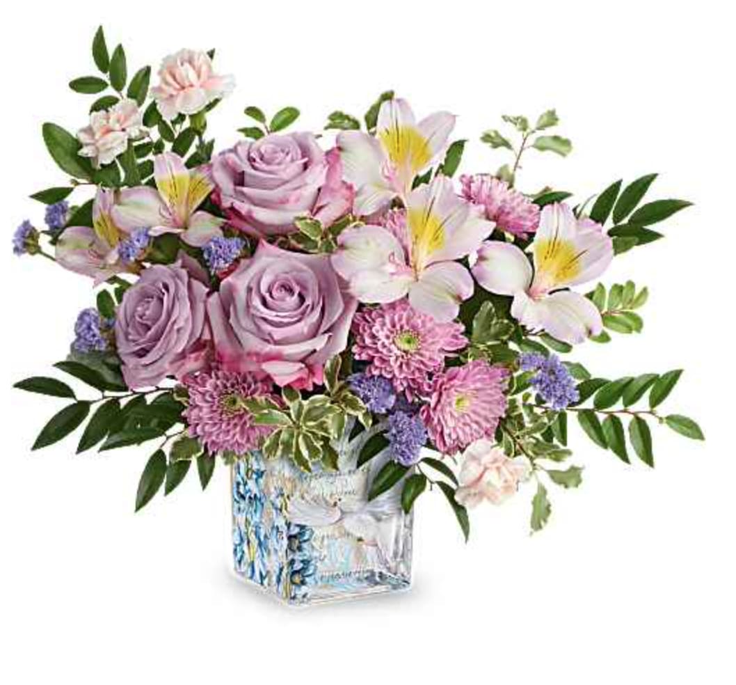 Written In The Sky - Peaceful and poetic, Written In The Sky Bouquet inspires serenity with lavender roses and soft pastel blooms arranged in a glass cube adorned with delicate flowers and a graceful dove design. Written In The Sky Bouquet includes lavender roses, lavender alstroemeria, pink miniature carnations, lavender cushion spray chrysanthemums, lavender sinuata statice, huckleberry, and pitta negra, presented in Written In The Sky Cube, a glass cube featuring a dove and floral design. Orientation: All-Around  SUBSTITUTION POLICY – Always deliver the freshest flowers! Please note the bouquet pictured reflects our original design.  If the exact flowers or container in this arrangement are not available, our local florists will create a beautiful bouquet with the freshest available flowers.