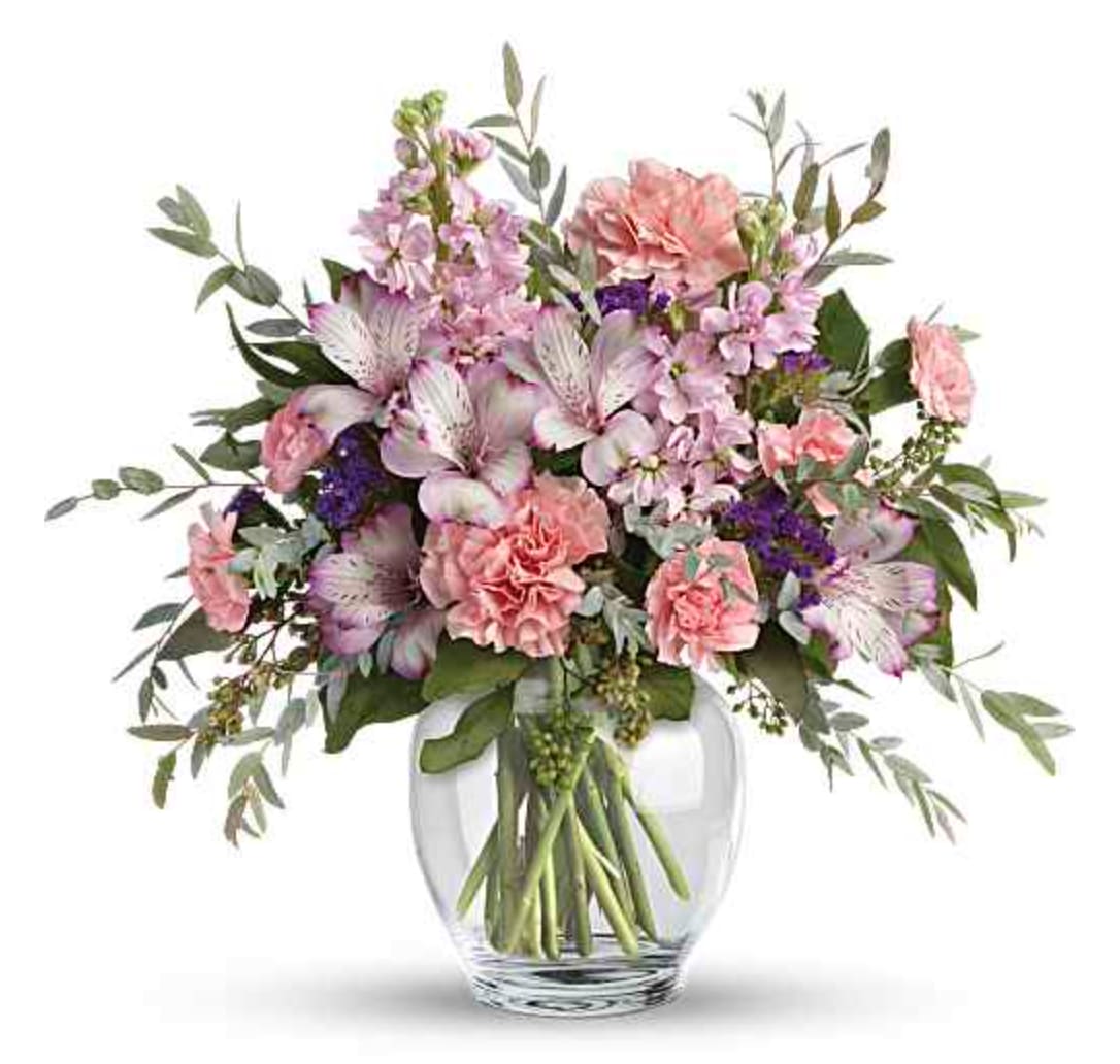 Pretty Pastel Bouquet - Oh so pretty! When you want to whisper your wishes for a wonderful occasion, send this pale pastel bouquet of roses alstroemeria, carnations and stock. This pretty arrangement includes crème roses, lavender alstroemeria, pink carnations, miniature pink carnations, pink stock, purple sinuata statice, parvifolia eucalyptus, and seeded eucalyptus. Delivered in Clear Glass Ginger Jar. Orientation: All-Around  SUBSTITUTION POLICY – Always deliver the freshest flowers! Please note the bouquet pictured reflects our original design.  If the exact flowers or container in this arrangement are not available, our local florists will create a beautiful bouquet with the freshest available flowers.