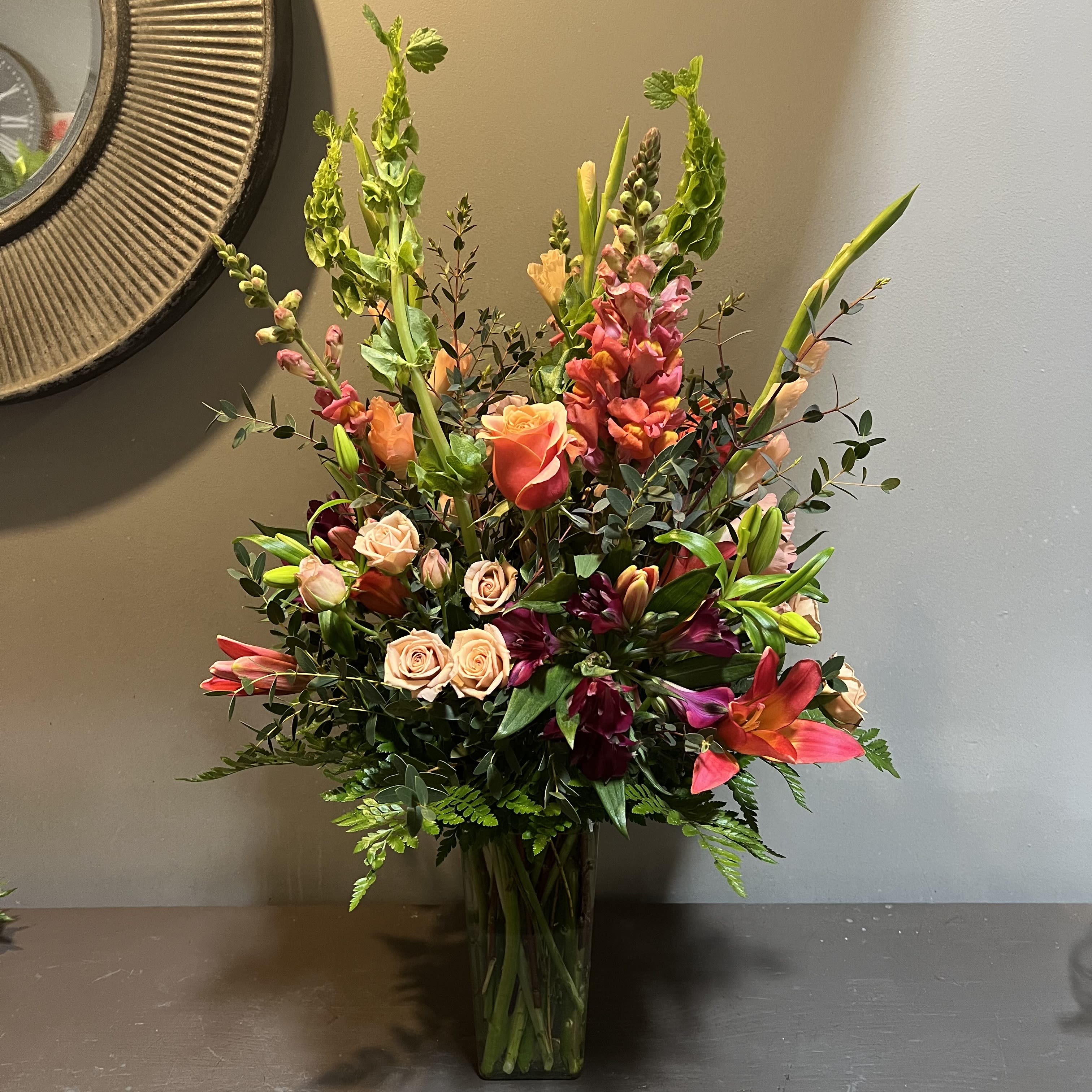 Jewel of my Eye - A luscious bouquet filled with jewel tones.  Measures approx. 30" tall x 18" wide and arrives in a glass vase.