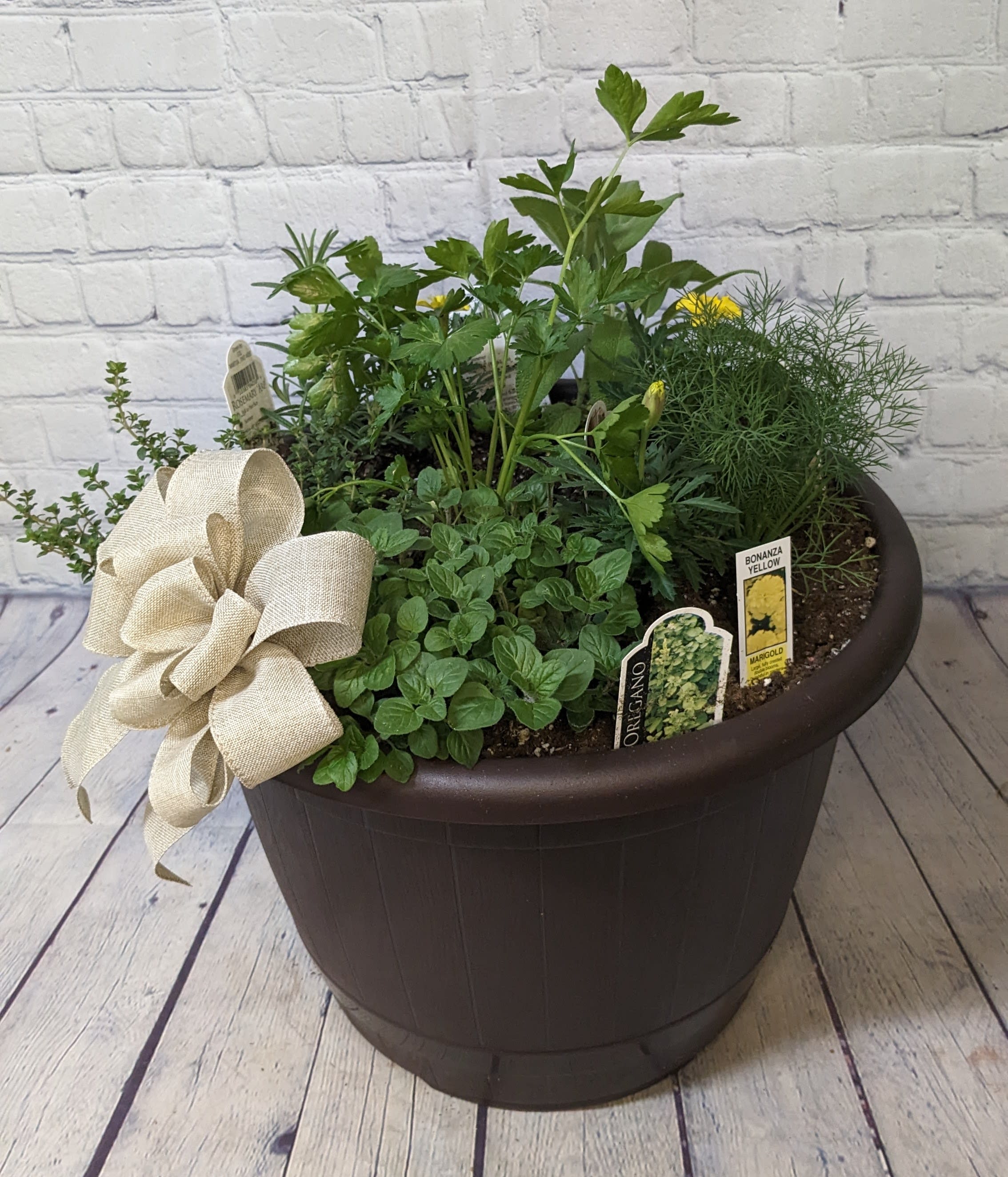 Herb Basket - For the gardener or cook in your life, we offer a fresh mixed herb basket planted with marigold companion plants. Herbs may include; basil Italian large leaf, basil purple ruffles, basil Genovese, bee balm, chives, cilantro, dill, lemon grass, spearmint, oregano, parsley flat, rosemary arp, rosemary tuscan blue, sage, tarragon, thyme english, or lavender. All herbs are subject to availability.