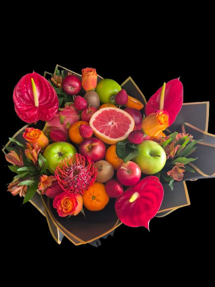 Passion Garden - Vivid red anthuriums and petite orange roses create a bold, celebratory bouquet that's perfect for birthday bouquets or festive gift arrangements. The tropical, colorful mix-bright pink accents, zesty citrus tones, and fresh green foliage-reads like a party in bloom and sends a joyful, lively message to the person you're celebrating.  This rounded, densely arranged composition pairs flowers with an assortment of fruit (apples, citrus, kiwi and a halved grapefruit) for an unexpected edible centerpiece effect. Wrapped in black paper with gold trim, the arrangement's contrast between dark wrapping and radiant blooms makes each color pop; textures range from the glossy anthurium petals to the soft rose heads and the smooth, juicy fruit. Sized to sit comfortably on a table or give as a hand-held gift, it's designed to feel both festive and substantial.  Give this to someone who delights in bright, unconventional gifts-a friend celebrating a milestone, a host at a summer party, or anyone who appreciates tropical flair. The combination of flowers and fruit makes it a memorable alternative to standard bouquets; for best enjoyment, keep it cool and serve the fruit soon after delivery.