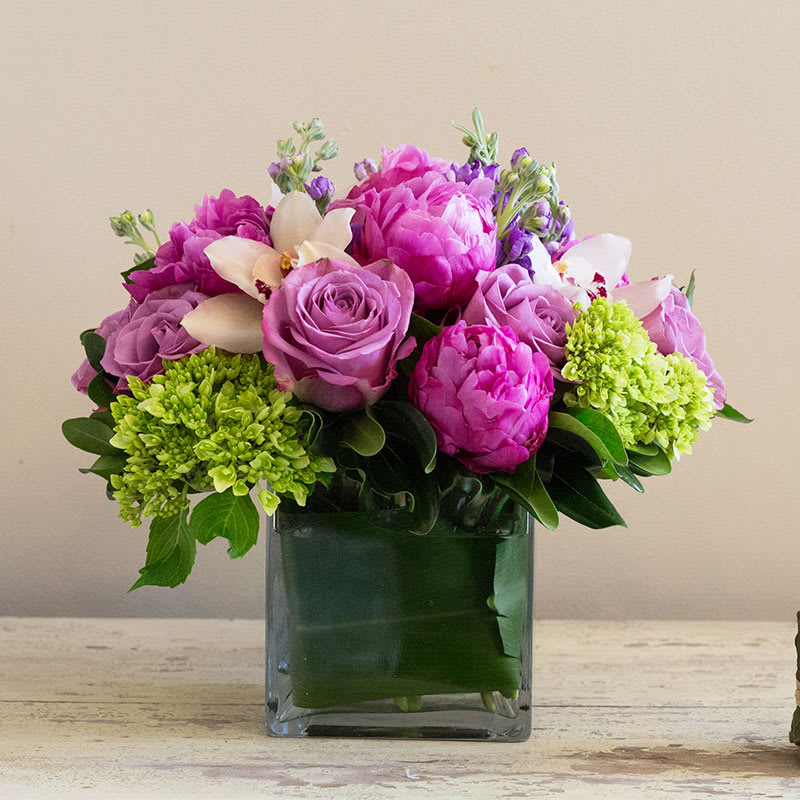 Joyous Jewels - A lush arrangement of roses, hydrangeas, orchids and peonies
