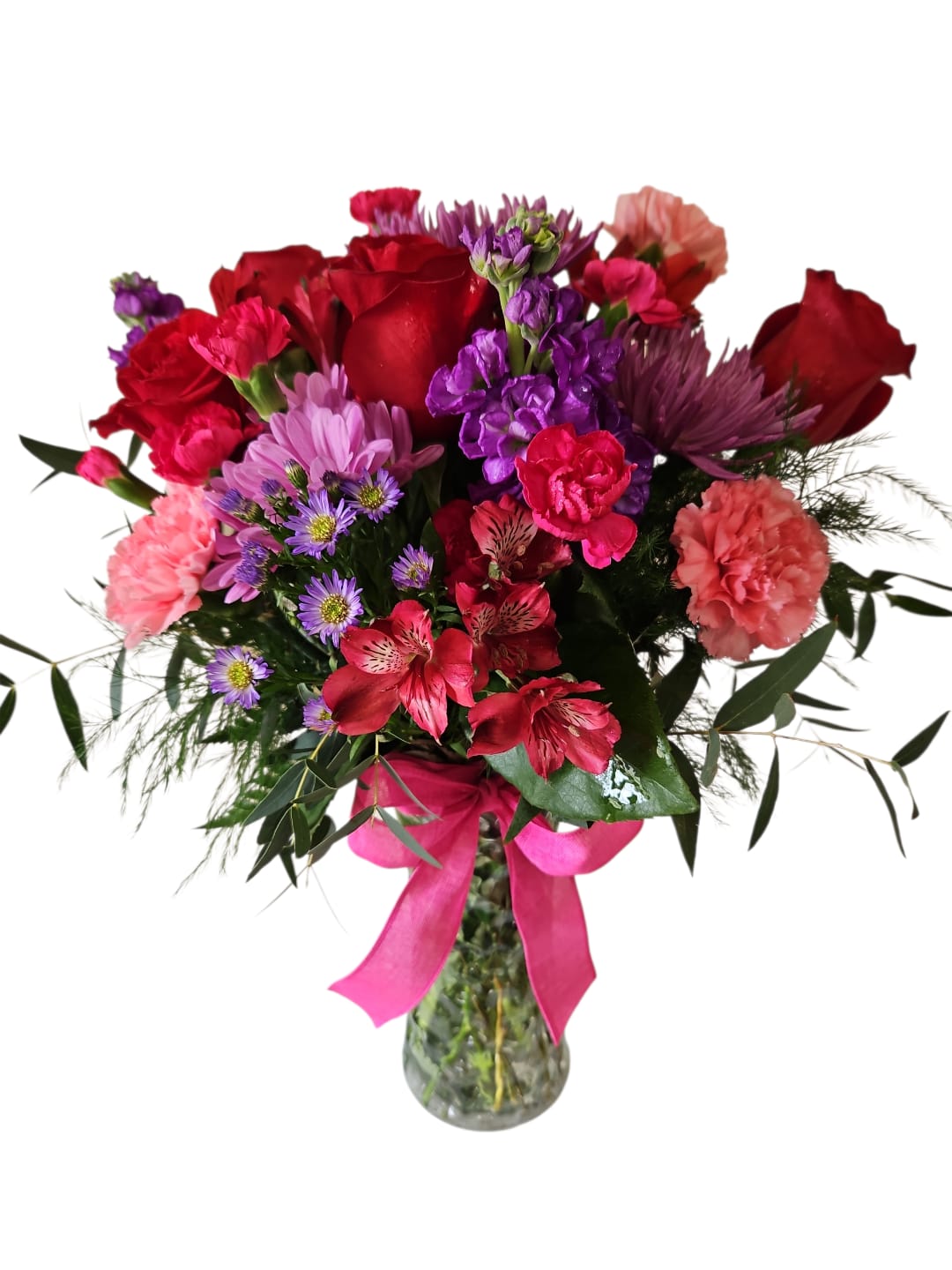Endless Love - Celebrate Mom with a beautiful arrangement that reflects love, appreciation, and heartfelt gratitude. Endless Love features a rich blend of blooms in warm reds, soft pinks, and soothing purple tones, creating an elegant and eye-catching display perfect for Mother’s Day.  Classic red roses bring a timeless symbol of love, while fragrant lavender stock adds height and gentle texture. Purple asters and purple chrysanthemums provide depth and fullness, complemented by soft pink carnations and vibrant red alstroemeria for added color and charm. Accented with lush tree fern, eucalyptus, and leather leaf greenery, the arrangement feels full and naturally beautiful. A graceful pink bow completes the design with a thoughtful finishing touch.  With its rich colors and elegant presentation, Endless Love is a wonderful way to show Mom how much she means to you and to make her Mother’s Day feel extra special.