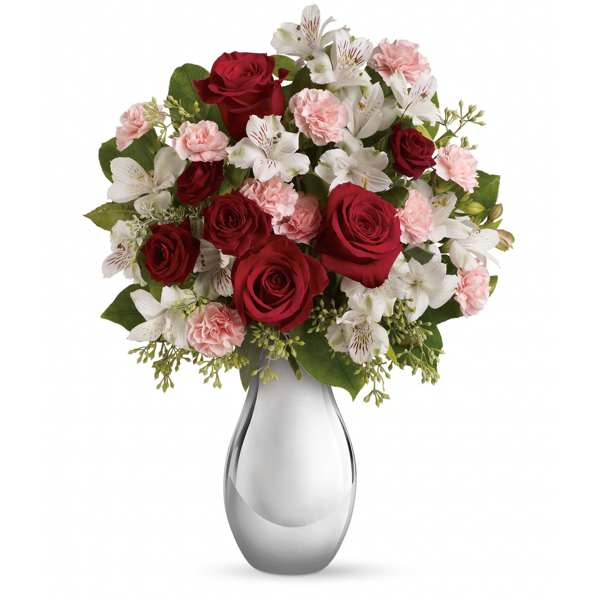 Bouquet of red roses, pink carnations, and white alstroemeria in a glass vase