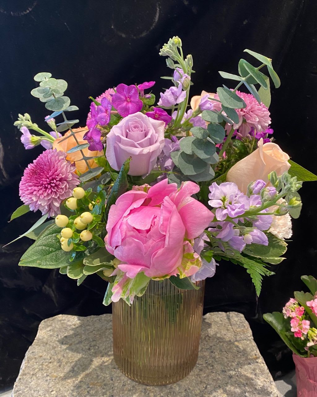 Pink and lavender bouquet in a ribbed glass vase