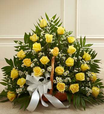 Sincerest Sympathies Fireside Basket - Yellow - Product ID: 91214   This touching tribute beautifully and tastefully expresses your sympathy and support. Long stem yellow roses, white Monte Casino, and more are arranged in a fireside basket by our expert floral designers Traditionally sent by family, friends or business associates Delivered directly to the funeral home Our florists use only the freshest flowers available so varieties and colors may vary Measures approximately 26âH x 36âL