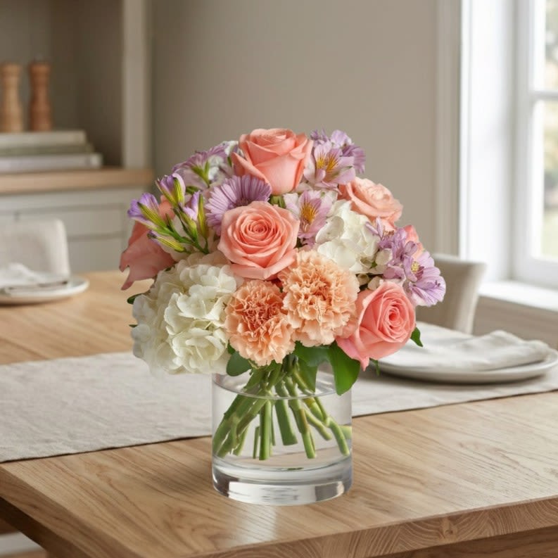Blush &amp; Bloom - A tender mix of pastel elegance, this arrangement blends vibrant pink roses, fluffy white hydrangeas, peachy carnations, lavender daisies, and speckled alstroemeria into a loving display. Perfect for Mother’s Day, it radiates gratitude and affection with every soft, graceful petal.