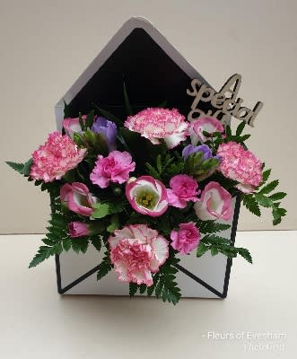 A Love Letter of Flowers  - A special just for Valentine’s Day, Wallace Flowers Love Letter of Flowers is a great way to say “I love you!” to your sweetheart: Mixed Flowers Arranged in an envelope vase.   This is an original Wallace Flowers design. Colors, containers, and prices are subject to change based on availability. 