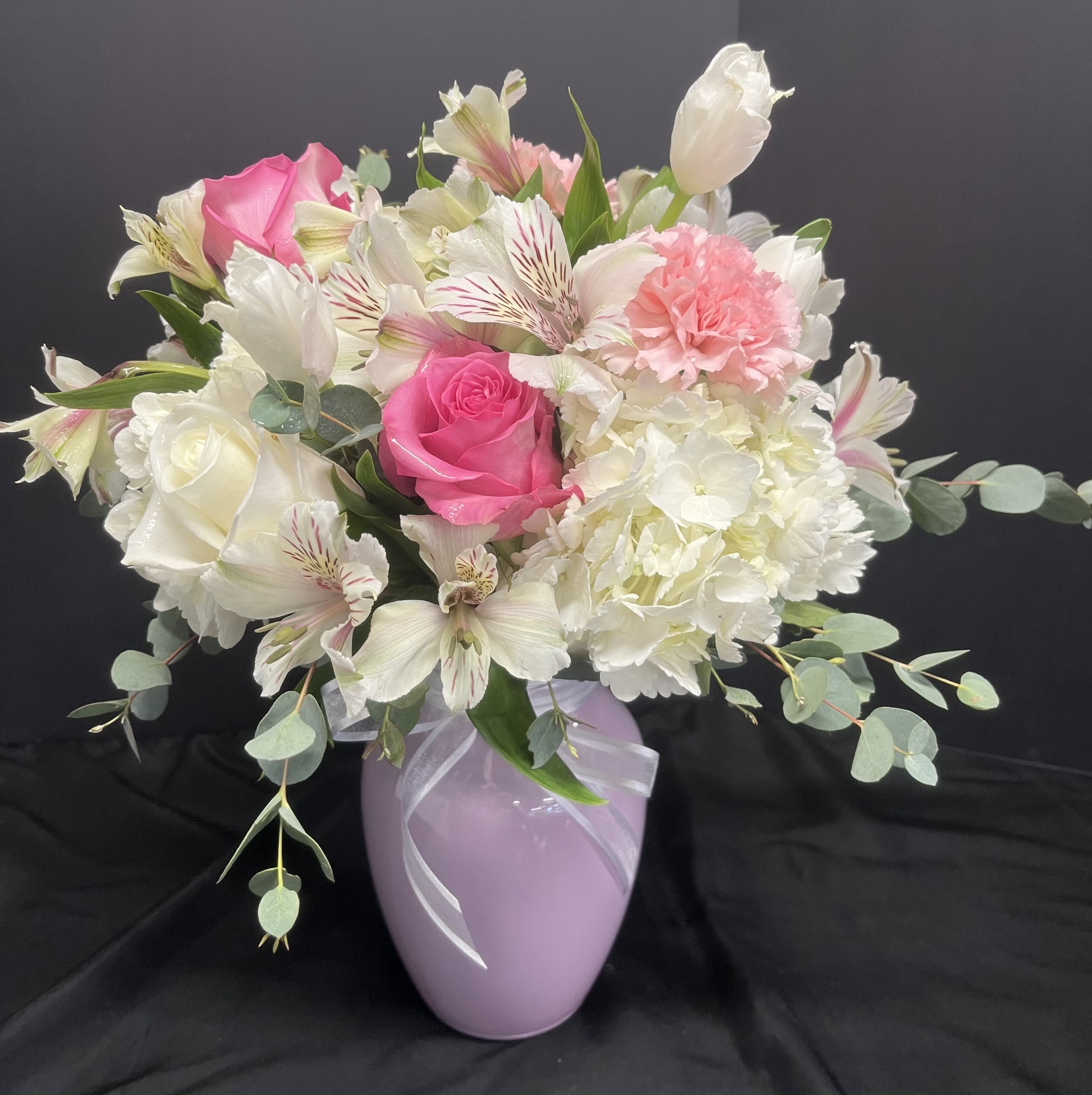 Timeless Treasure - Our timeless treasure arrangement is designed for "MOM" in a beautiful jellybean vase. Vases come in varying pastel colors. Arrangement will be similar to the picture shown.
