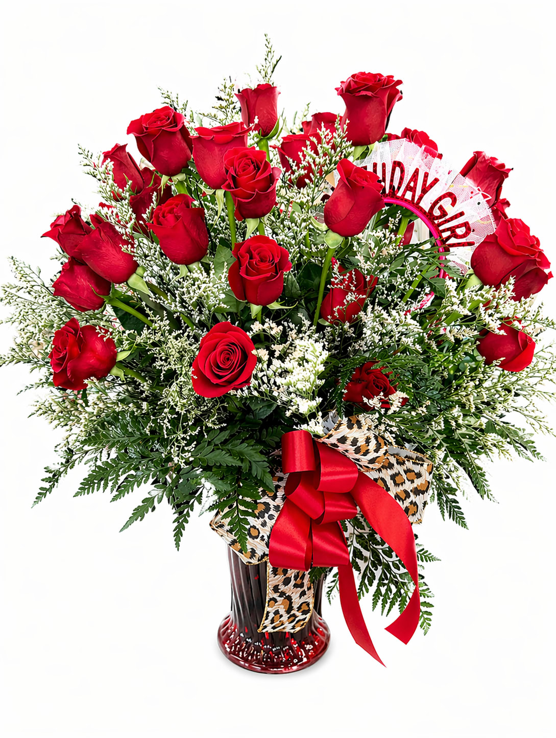 Three Dozen Roses  - A striking three dozen roses take center stage in this bold bouquet—rich red blooms gathered for a full, romantic look in a clear glass vase. Soft white fillers and airy greenery add texture and movement, while a  bow adds the perfect finishing touch. 