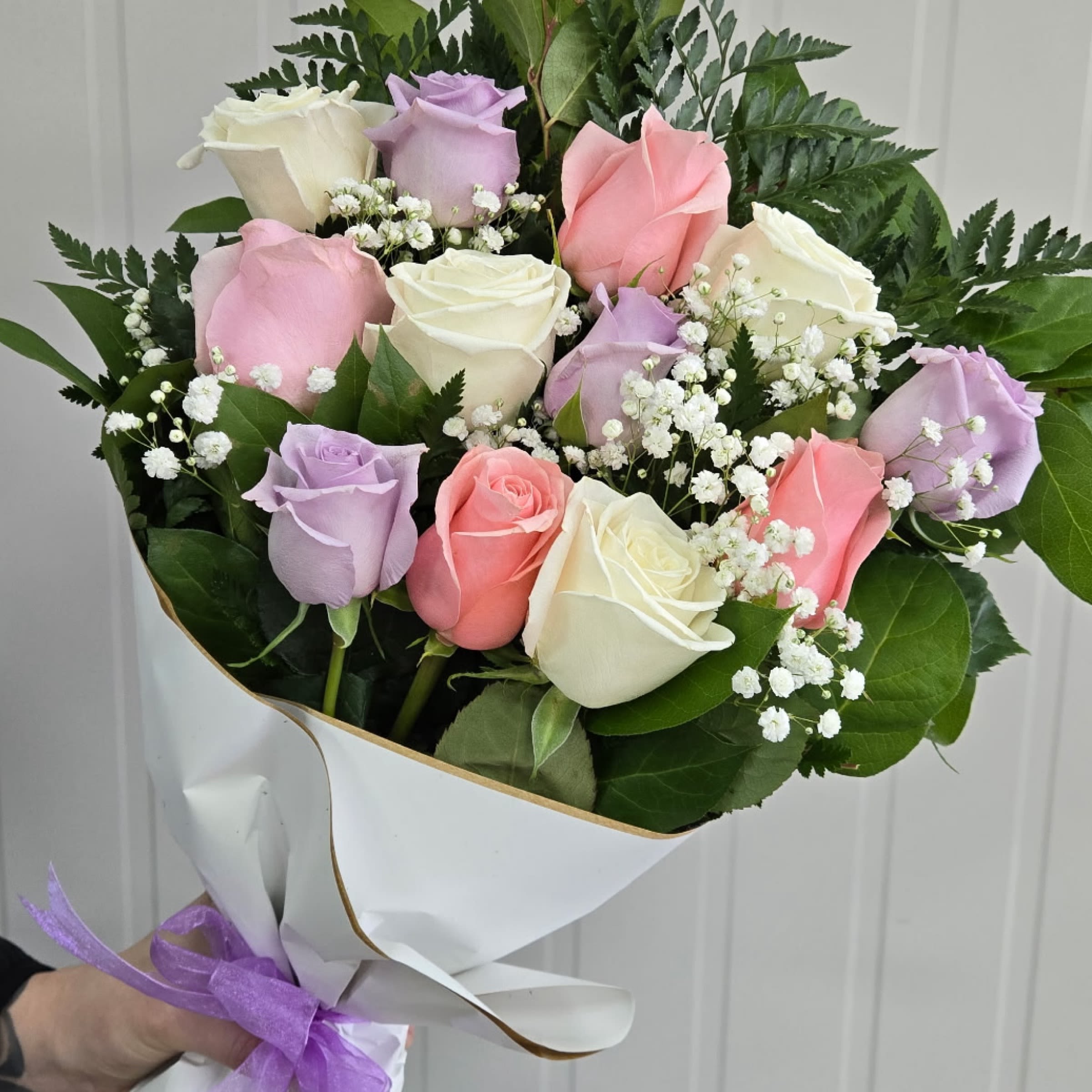 Wrap- Classic Pastel Dozen Roses - This Item includes Rose's, Filler Flower and Greenery Wrapped in Paper and a Matching Bow. Vase Not Included