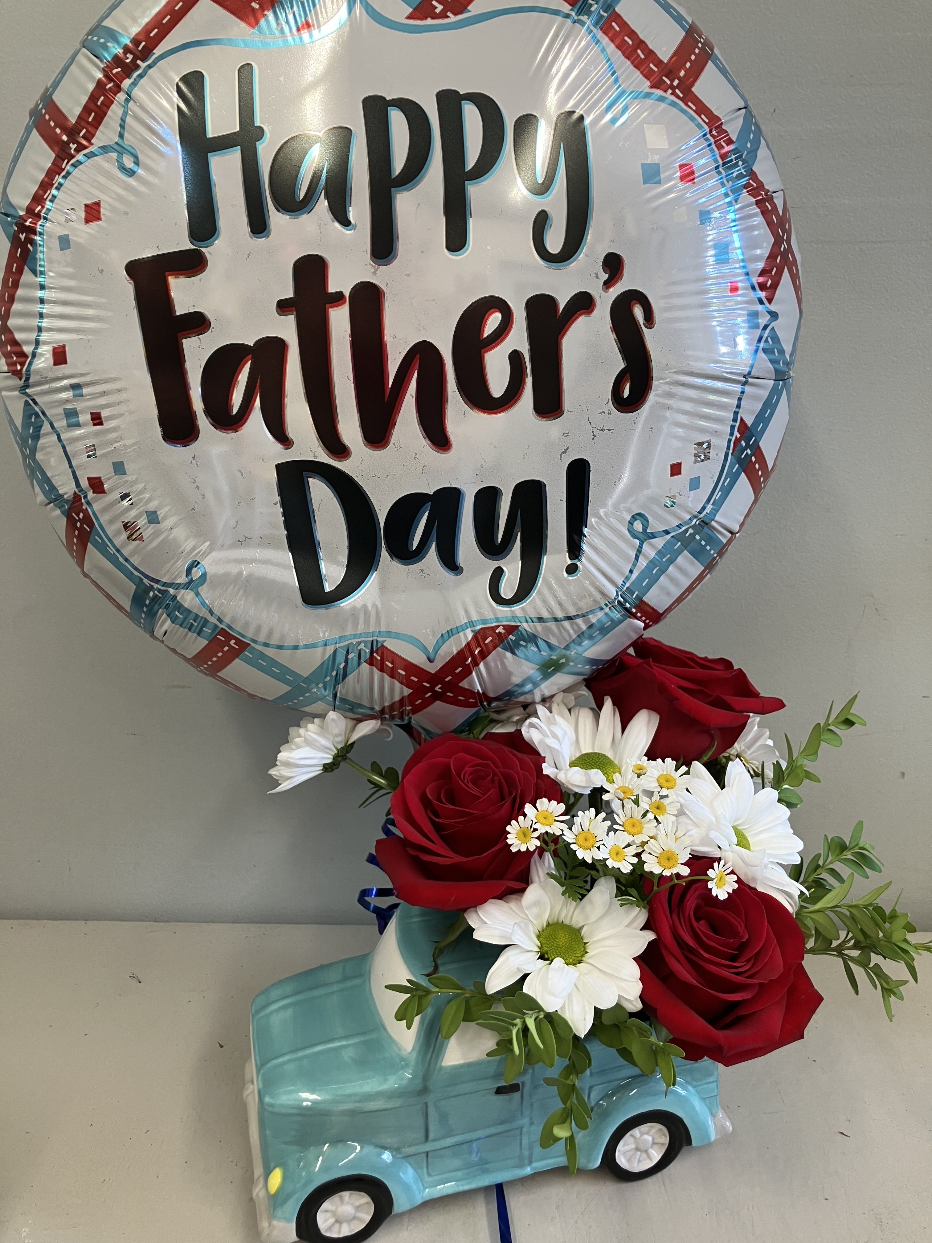 Classic Dad Gift - We have a mylar balloon and a cute teal ceramic truck filled with bright flowers to celebrate the dad that loves trucks and taught you how to drive! 