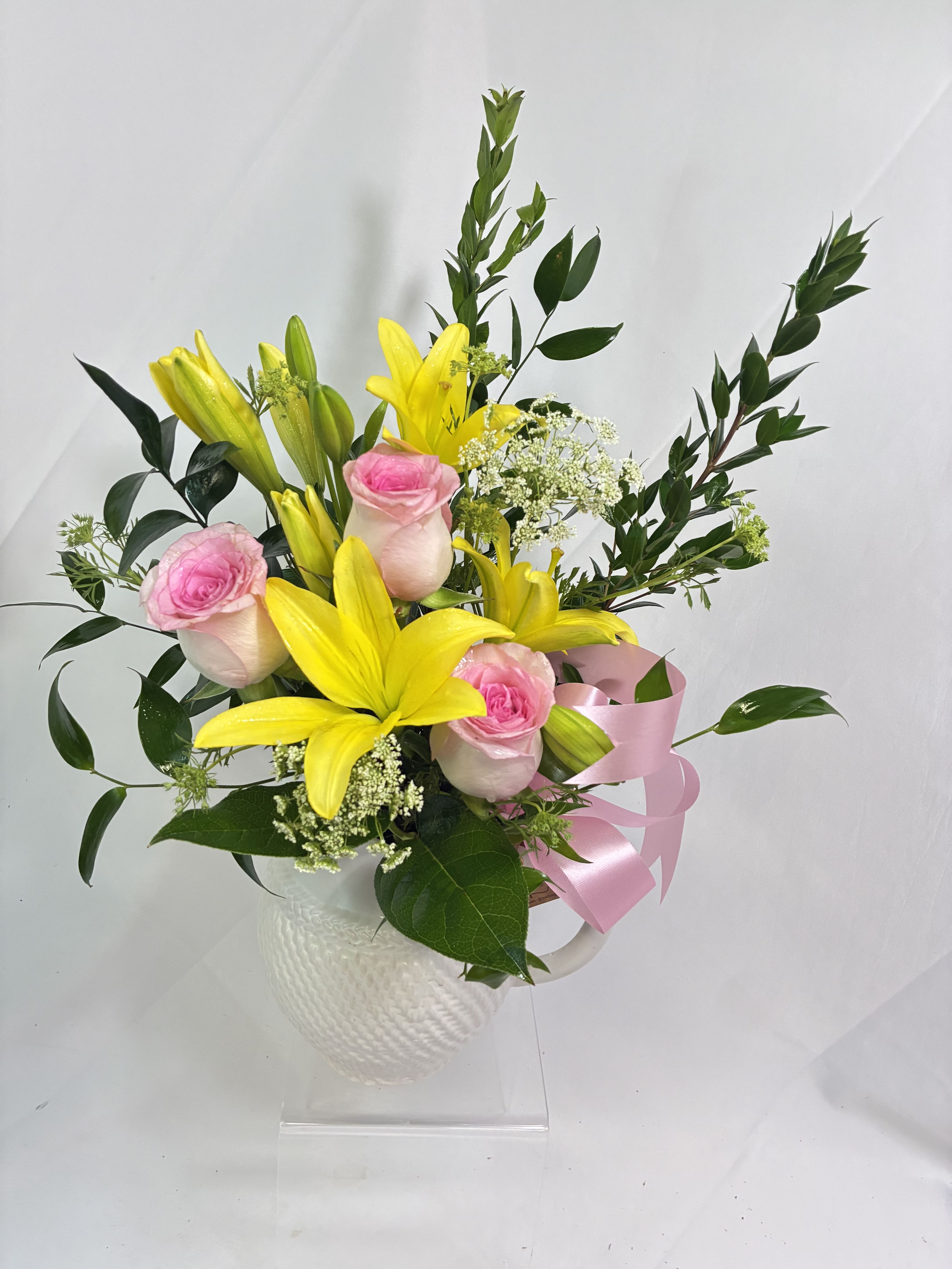 Pitcher of Petals - This is the perfect gift of fresh flowers and a keepsake pitcher by Mud Pie Gift to use always! These fresh Lilies &amp; Roses, are accented by airy Queen Ann’s Lace or similar filler flowers for the same effect!  What a delightful Spring gift! 
