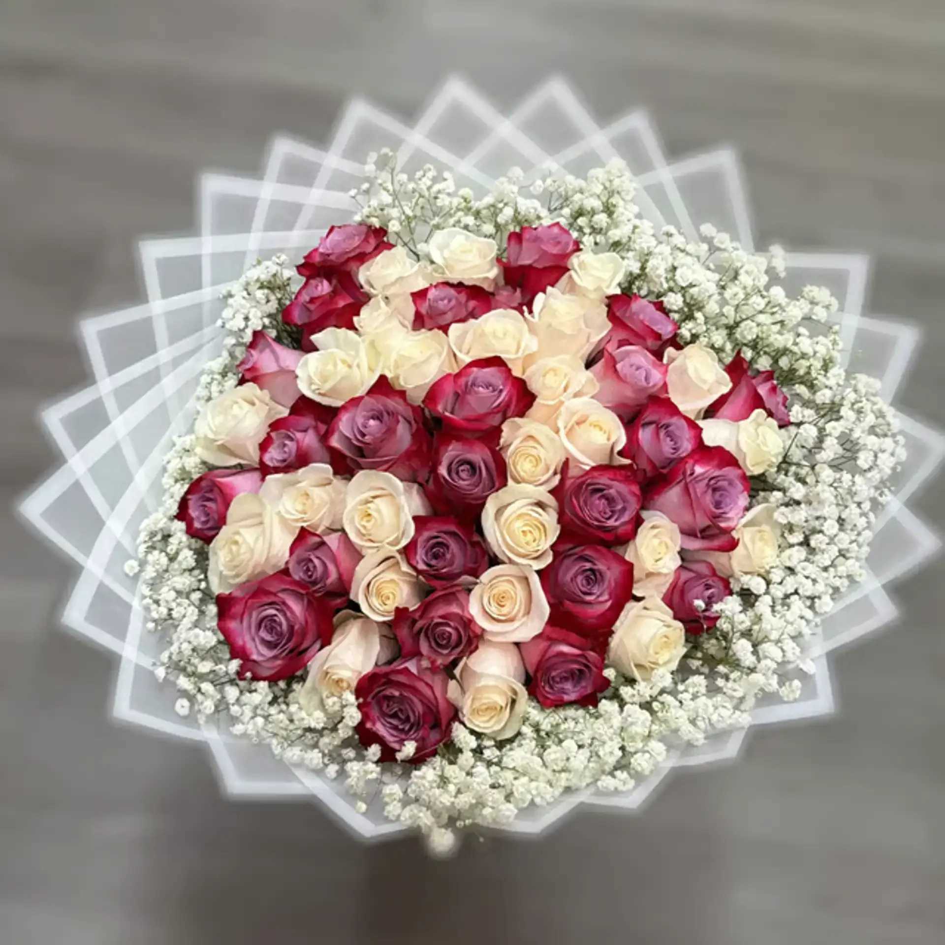 TWILIGHT BOUQUET - 50 PURPLE, WHITE ROSES WHITE PAPER ( THE DESIGN OF PAPER WILL DIFFER DEPENDING ON SUPPLY)