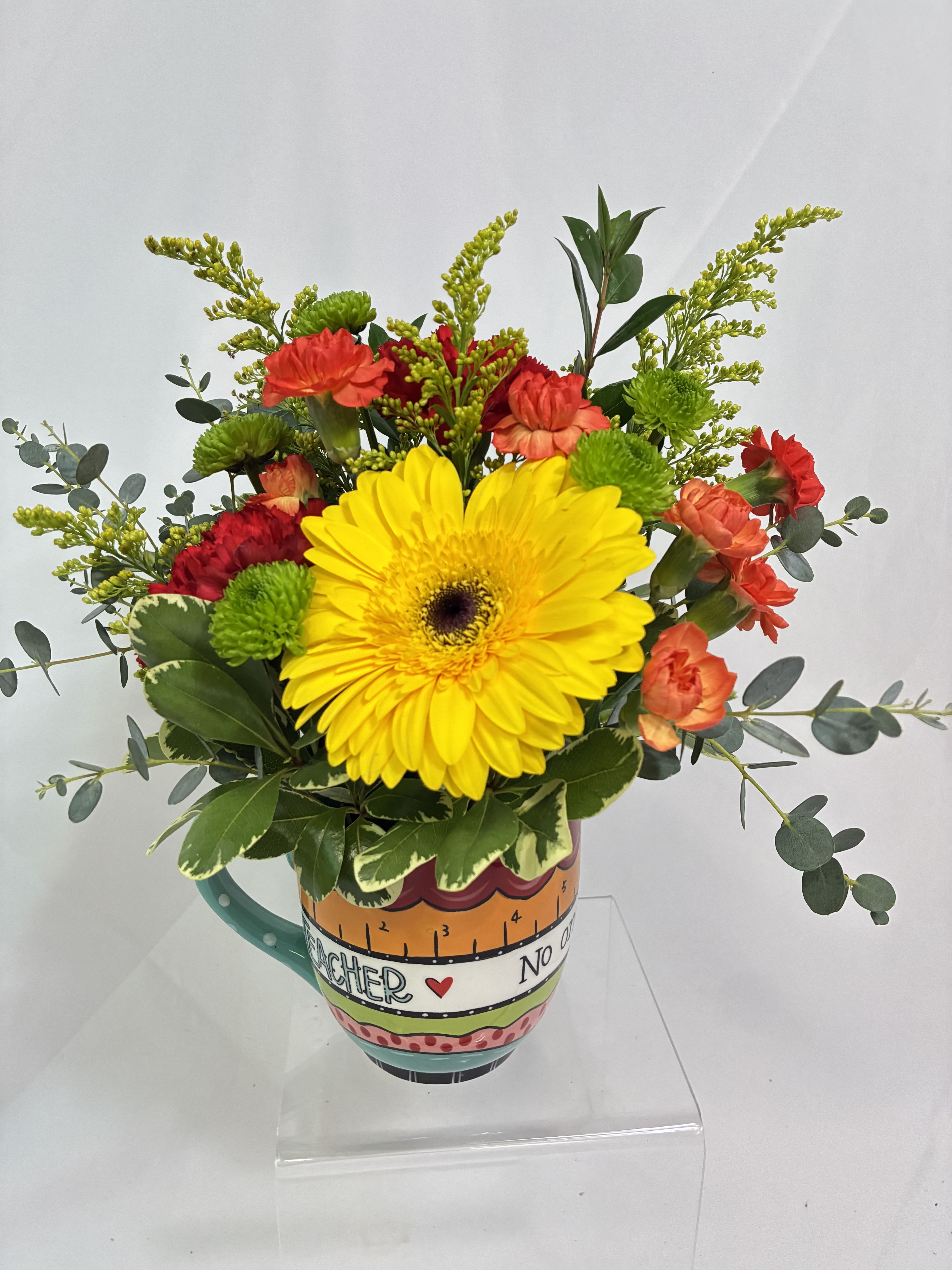 Teacher Mug Bouquet - Thank your special teachers with this bright bouquet in a large, keepsake mug by Glory Haus gifts!  Fresh bright Gerber Daisy with Chrysanthemums color a bright cup of gratitude to that special teacher!