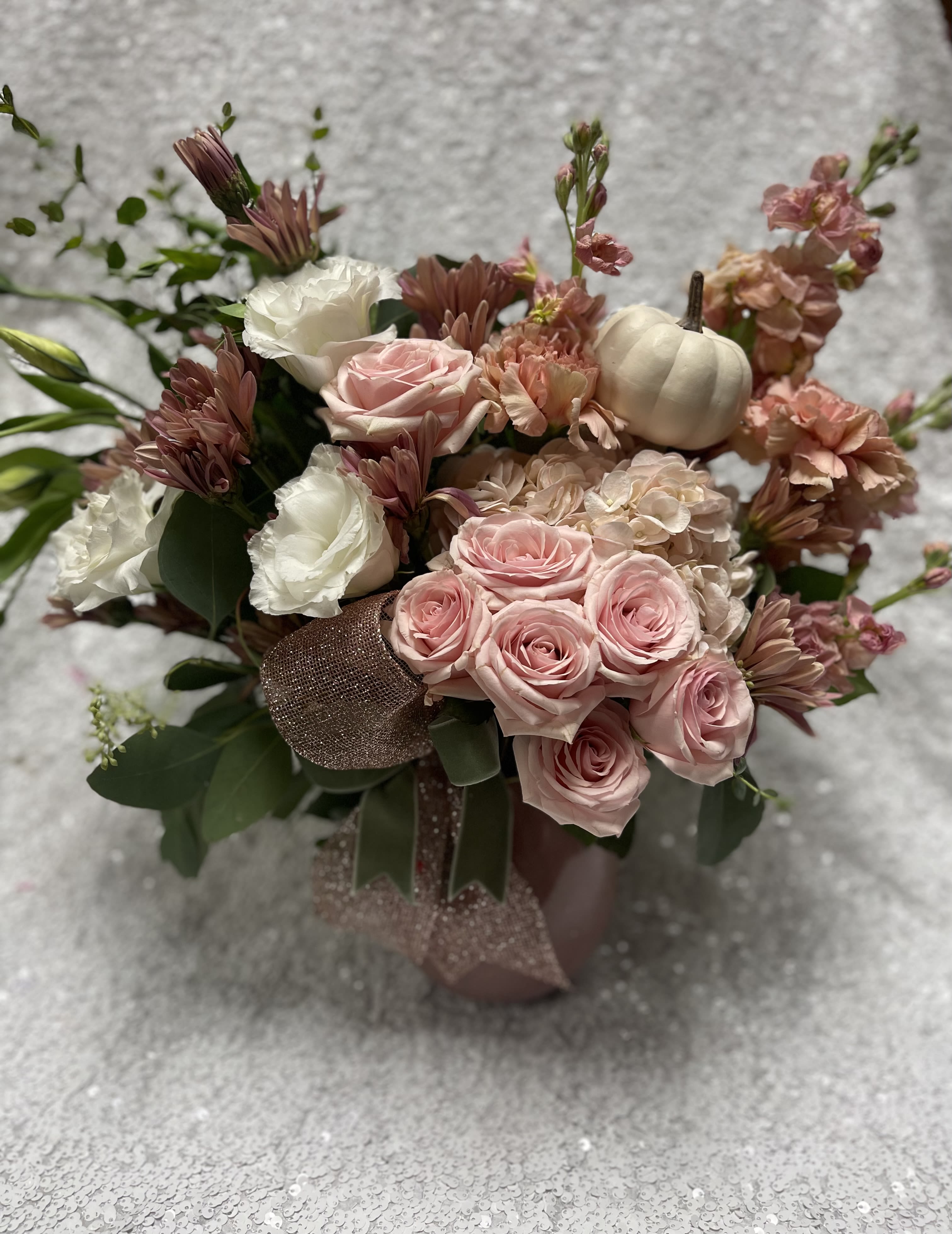 Pink and white rose bouquet with mums and a small white pumpkin