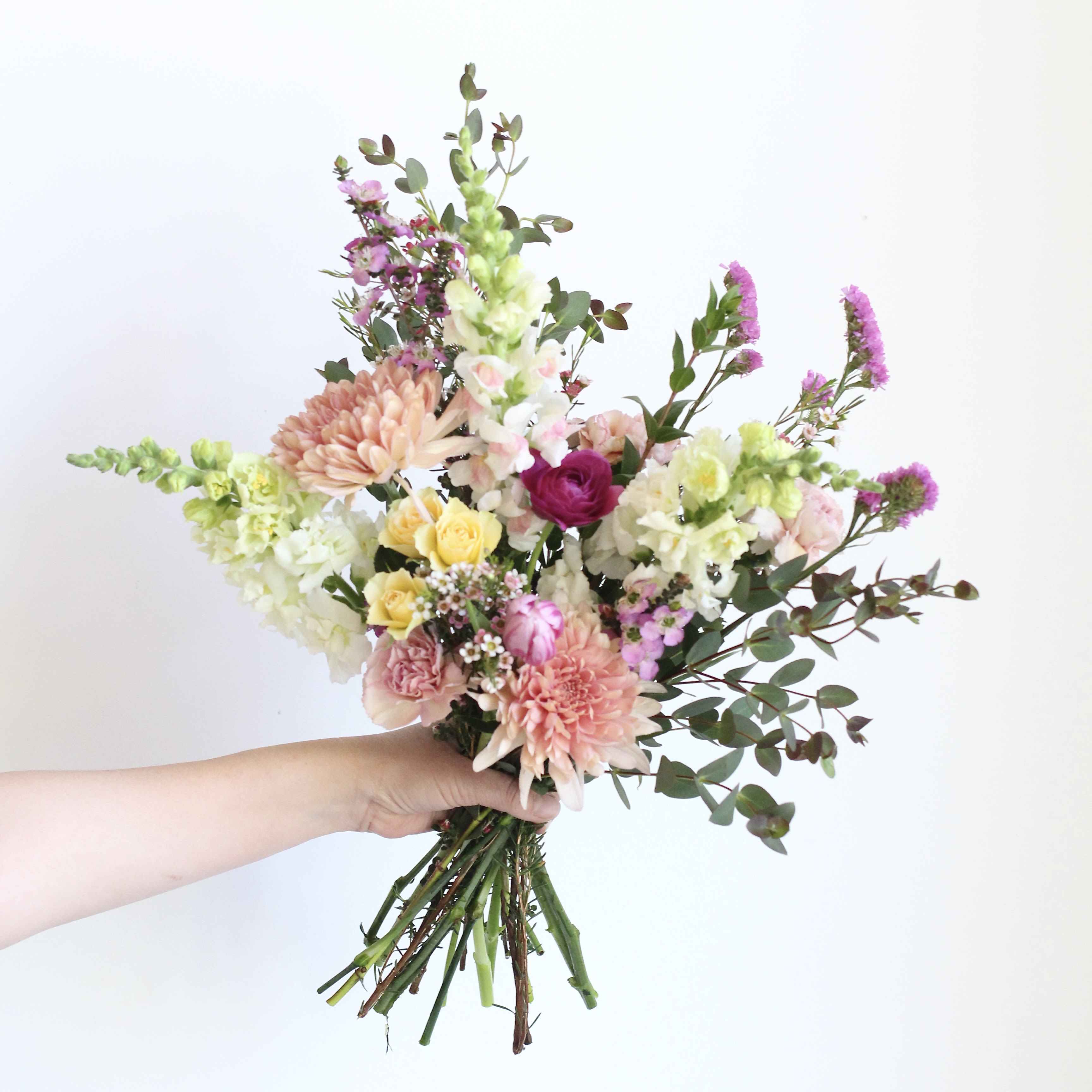 Designer's Choice Bouquet -Petite - Unique and thoughtfully designed by our florists using an ever changing palette of fresh flowers and foliage.  Sourced from Colorado and US-grown when possible, and high-quality select imports.  While specific blooms cannot be guaranteed, each arrangement will feature a beautiful, balanced selection, and we will gladly do our best to accommodate special requests.  Your bouquet will be gift wrapped in paper and ribbon, and the stems will be bundled in a wet wrap to help keep them fresh until they can be placed into a vase.  Delivery Policy: At Middlemist, we aim to make every delivery seamless and delightful. It is the sender’s responsibility to ensure the recipient is available to accept delivery between 3–5pm on the scheduled date and that the delivery address is accurate. We will send a text notification to the recipient on the day of delivery. If no one is available to receive the order, it will be returned to the shop and may be picked up or redelivered for an additional delivery fee. If a recipient requests the order be left unattended, we cannot guarantee the condition of the flowers or plants, and no refunds will be issued once an order is left outside.