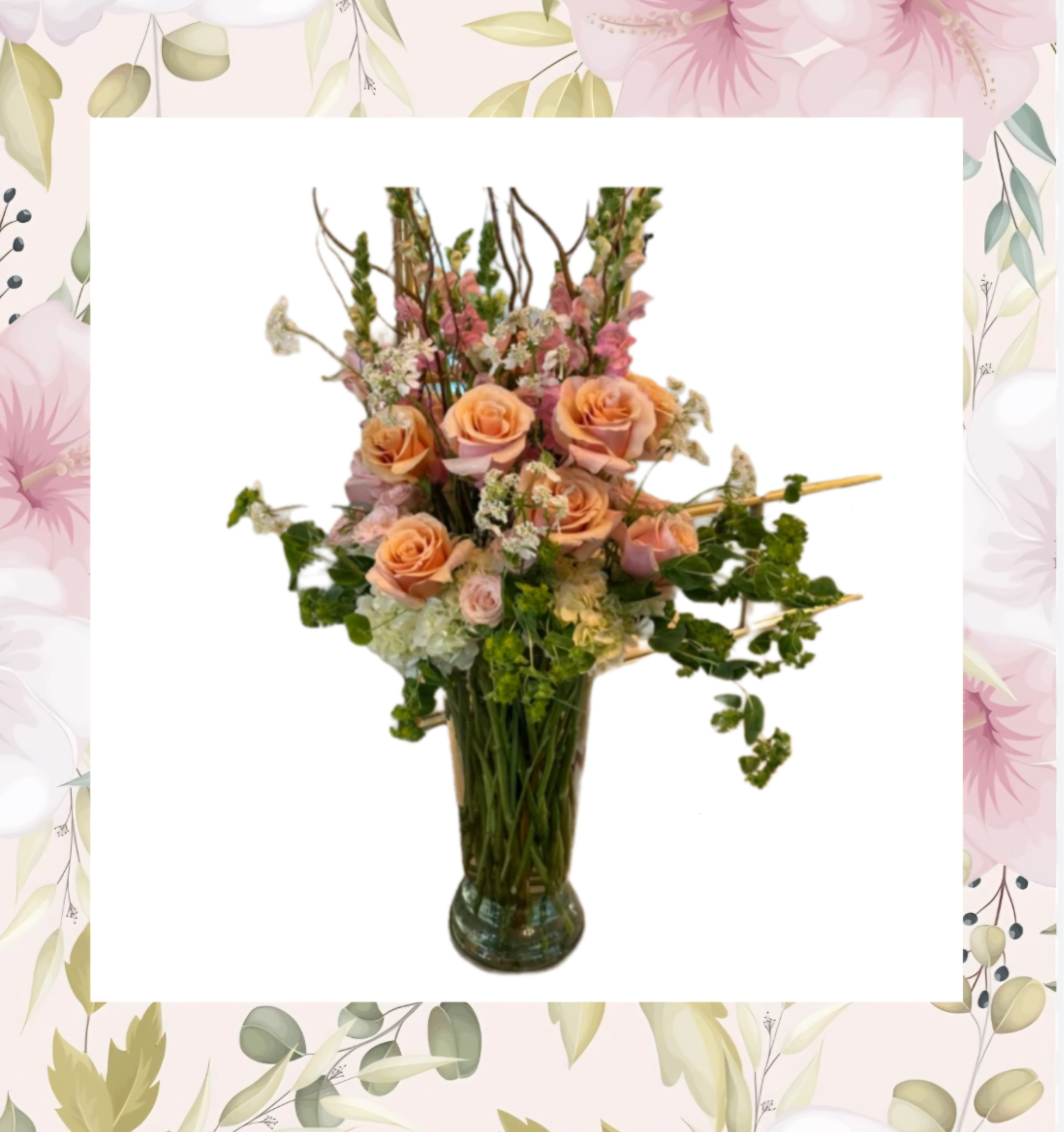 Peach roses and pink flowers arranged in a glass vase