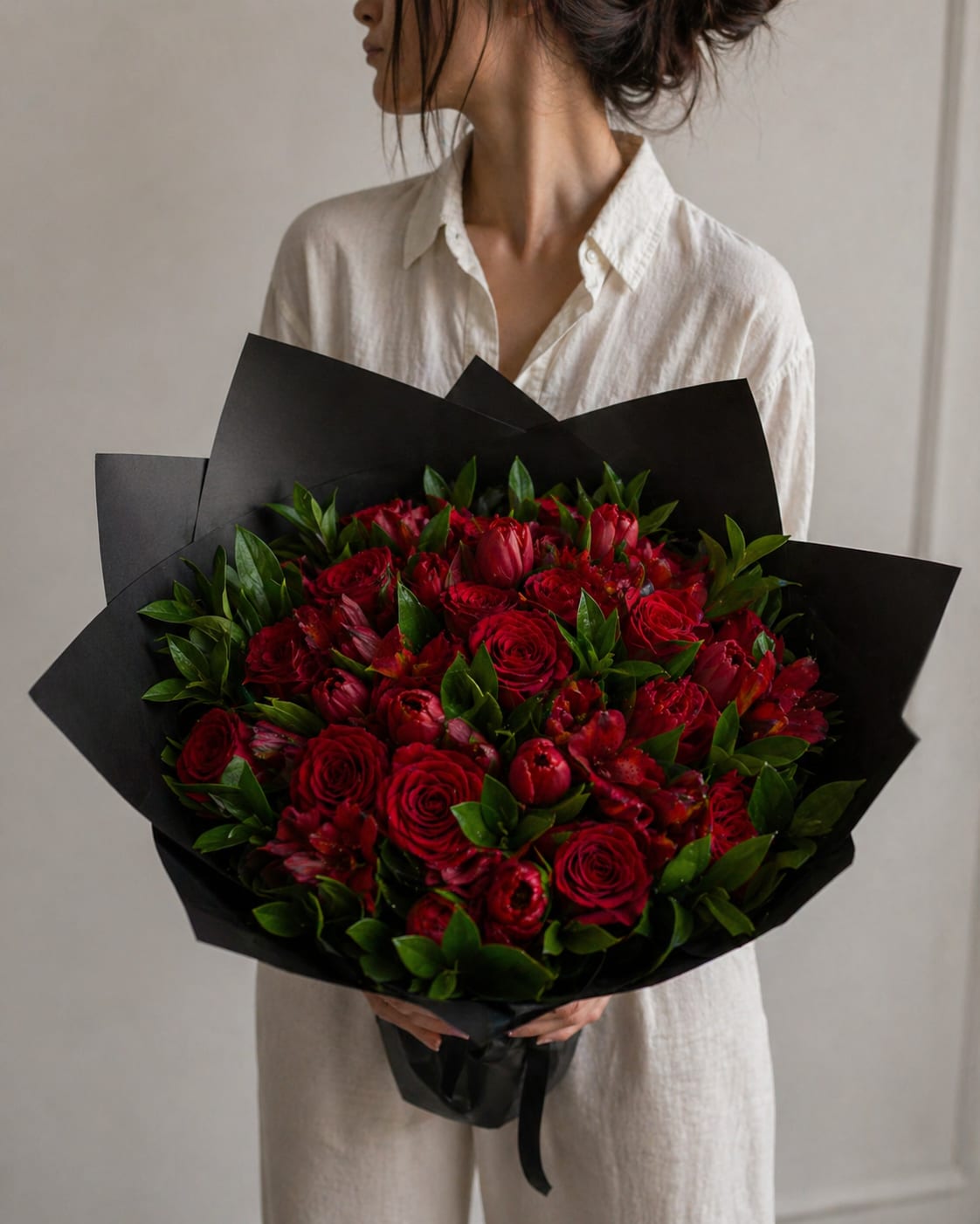 Mother’s Day Special — Designer’s Choice (Classic Love) - Designer’s Choice arrangement inspired by a deep red palette, wrapped in black for a bold, timeless look. Each bouquet is uniquely created using the freshest seasonal flowers available. While exact blooms may vary, the overall style, color story, and feeling will always reflect the design shown. Deluxe size pictured. Standard and Premium follow the same concept.