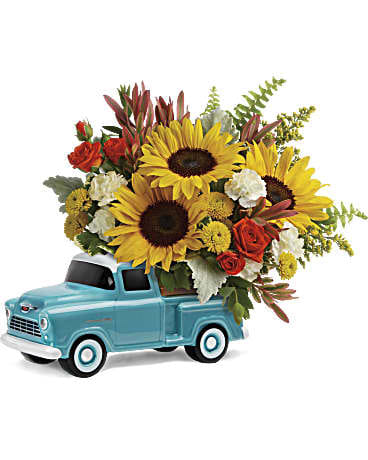 Sunflower bouquet arranged in a blue toy pickup truck