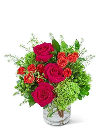 Chic Citrus Blooms - Chic Citrus Blooms will bring a burst of vibrant energy with its exquisite combination of hot pink, orange, and green hues. This stunning floral arrangement, set in a clear vase, features a blend of Roses, Green Trick Dianthus, Hydrangea, and Hypericum Berry, accented with premium foliage. It makes the perfect birthday or get-well gift, with its cheerful charm.