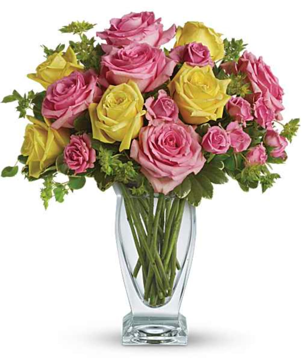 Glorious Day - Pink lemonade, anyone? This stunning bouquet of pink and yellow roses adds an instant smile to anyone's face - especially when they notice the gorgeous Couture Vase they get to keep using for years to come! Elegant pink and yellow roses are contrasted with green bupleurum and variegated pittosporum. Delivered in an eye-catching clear glass vase. Orientation: All-Around  SUBSTITUTION POLICY – Always deliver the freshest flowers! Please note the bouquet pictured reflects our original design.  If the exact flowers or container in this arrangement are not available, our local florists will create a beautiful bouquet with the freshest available flowers.