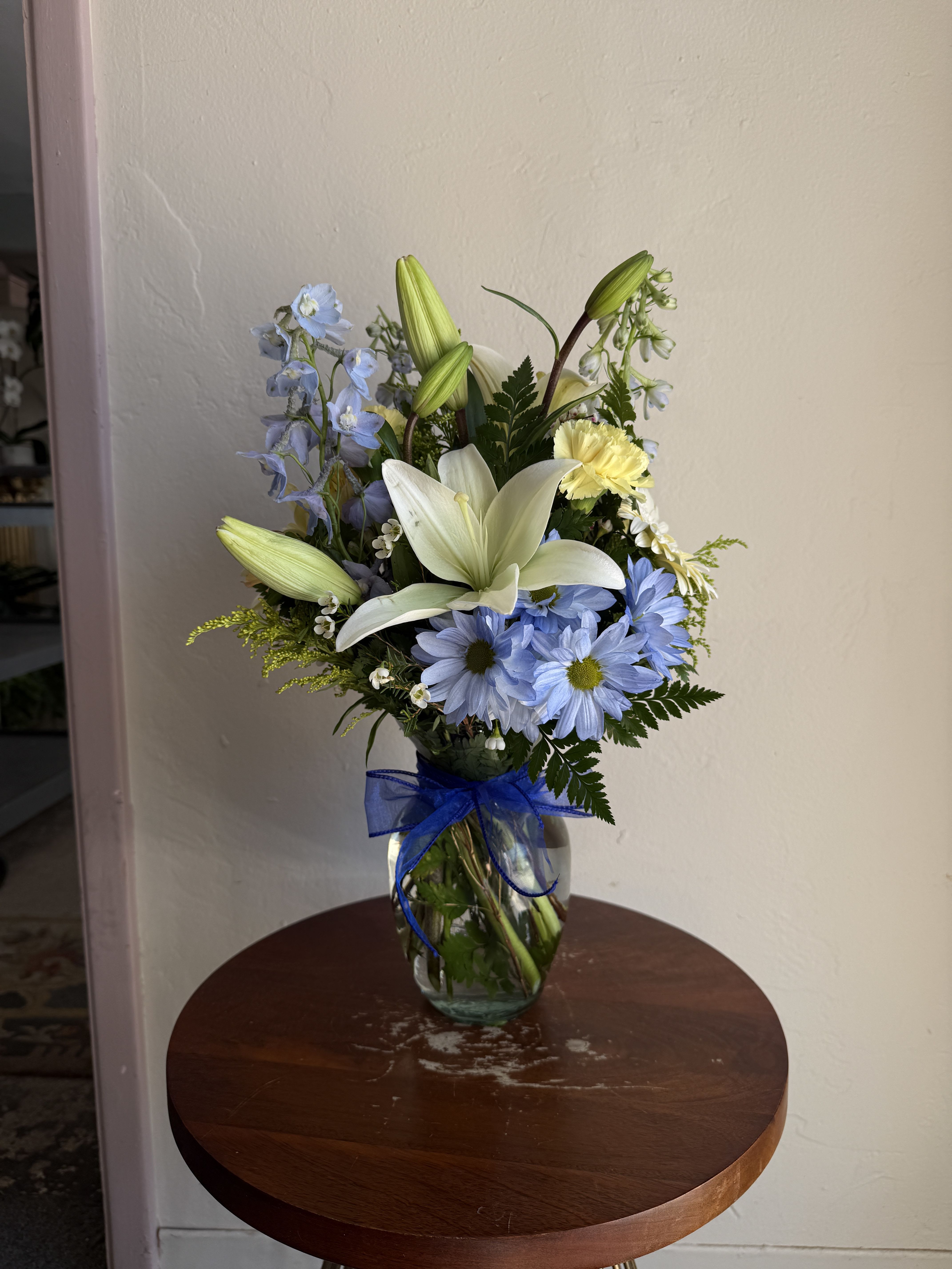 The Baby Bloom - Blue - A fresh arrangement in soft blues and calming tones, perfect for welcoming a baby boy with a touch of warmth and happiness.