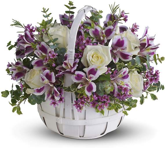 White basket of white roses and purple alstroemeria