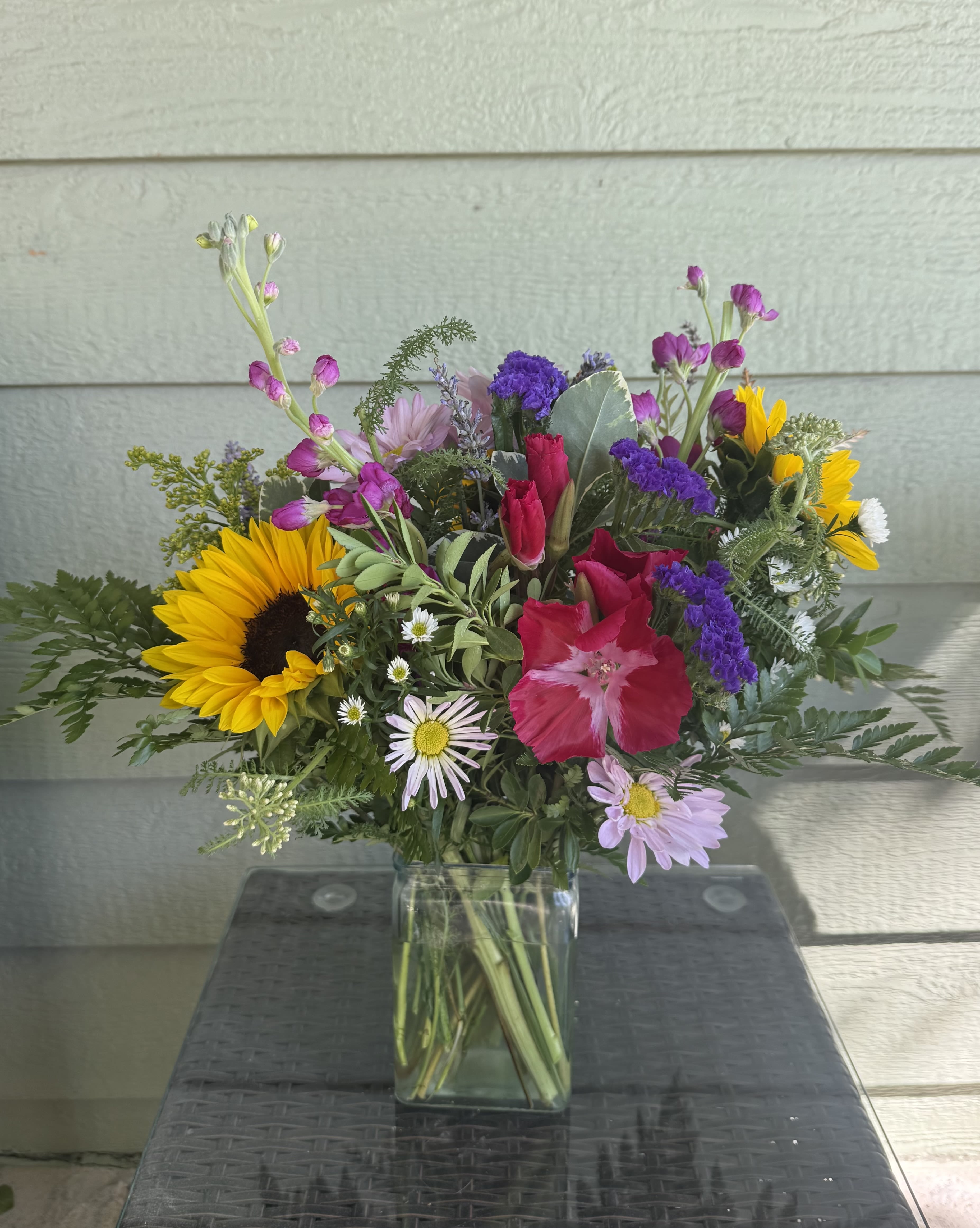 Summer Wildflower Designers Choice - Colorado wildflowers are in full bloom for summer. Send our Summer Wildflower Designers Choice arrangement and we will Include these beautiful seasonal blooms.   “In a field of roses, she’s a wildflower”