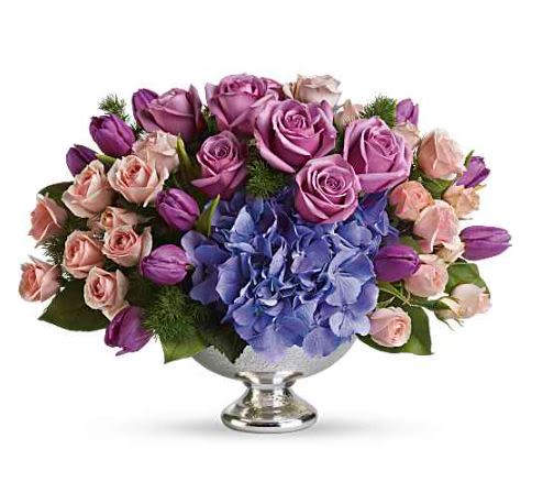 Purple Elegance Centerpiece -  Pet Friendly? No This arrangement contains Tulips, which are toxic to both cats and dogs if ingested (especially the bulbs). Keep this centerpiece on a high table out of reach from curious household pets.   Human Allergy Note No major allergy-triggering flowers noted. As a precaution, keep the arrangement in a well-ventilated area away from direct sleeping quarters.   Care &amp; Longevity To keep your centerpiece fresh, check the water level daily by peering through the blooms and adding water to the bowl. Keep the arrangement away from direct sunlight, heating vents, or drafty windows. Gently remove any fading petals or leaves to maintain the overall health of the remaining flowers.   Best Occasions &amp; Situations  Congrats/Celebration — formal dinners, promotions  Wedding’s — rehearsal tables, bridal showers  Romance/Anniversary — intimate date nights  Autumn Flower — rich jewel-tone palette  Just Because — elevated host gift ‍ Labor Day — upscale gatherings  Mother's Day — sophisticated color story  Wedding’s — head table or guest tables  Why Customers Love It Sophisticated color palette of royal purples and soft pinks. Low-profile design makes it the perfect conversation-friendly centerpiece. High-end container that can be reused for future decor. Fresh variety of textures from soft hydrangea to sleek tulips.