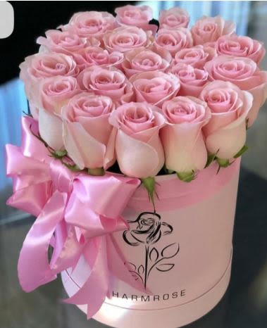 Blush Harmony-Pink Rose Box -  Pet Friendly? Yes Roses are non-toxic to dogs and cats. However, because roses have sharp thorns and these are arranged in floral foam, keep them out of reach of curious household pets to avoid accidental scratches or ingestion of the foam.    Human Allergy Note No major allergy-triggering flowers noted. As a practical caution, keep the arrangement in a well-ventilated area to enjoy the natural, light fragrance of the roses.   Care &amp; Longevity To keep your roses looking their best, simply add a small amount of fresh water to the center of the box every 1–2 days to keep the floral foam moist. Avoid getting water on the rose petals or the cardboard box itself. Keep the arrangement away from direct sunlight, heating vents, and ceiling fans to prevent the blooms from wilting prematurely.    Best Occasions &amp; Situations  Romance/anniversary — soft, classic expression of love  Birthday — elegant and universally loved  Thinking of you — gentle, uplifting gesture  Flower crowns — matches bridal/bridal party themes  Just because — make an ordinary day special  Mother's Day — timeless pink for mom  Wedding's — perfect for bridal suite or thank-you  Why Customers Love It Gift-ready presentation that doesn’t require a separate vase. Modern aesthetic that fits perfectly on a desk, nightstand, or coffee table. Premium rose quality with large, lush bloom heads. Versatile color palette that works for both happy and somber occasions.