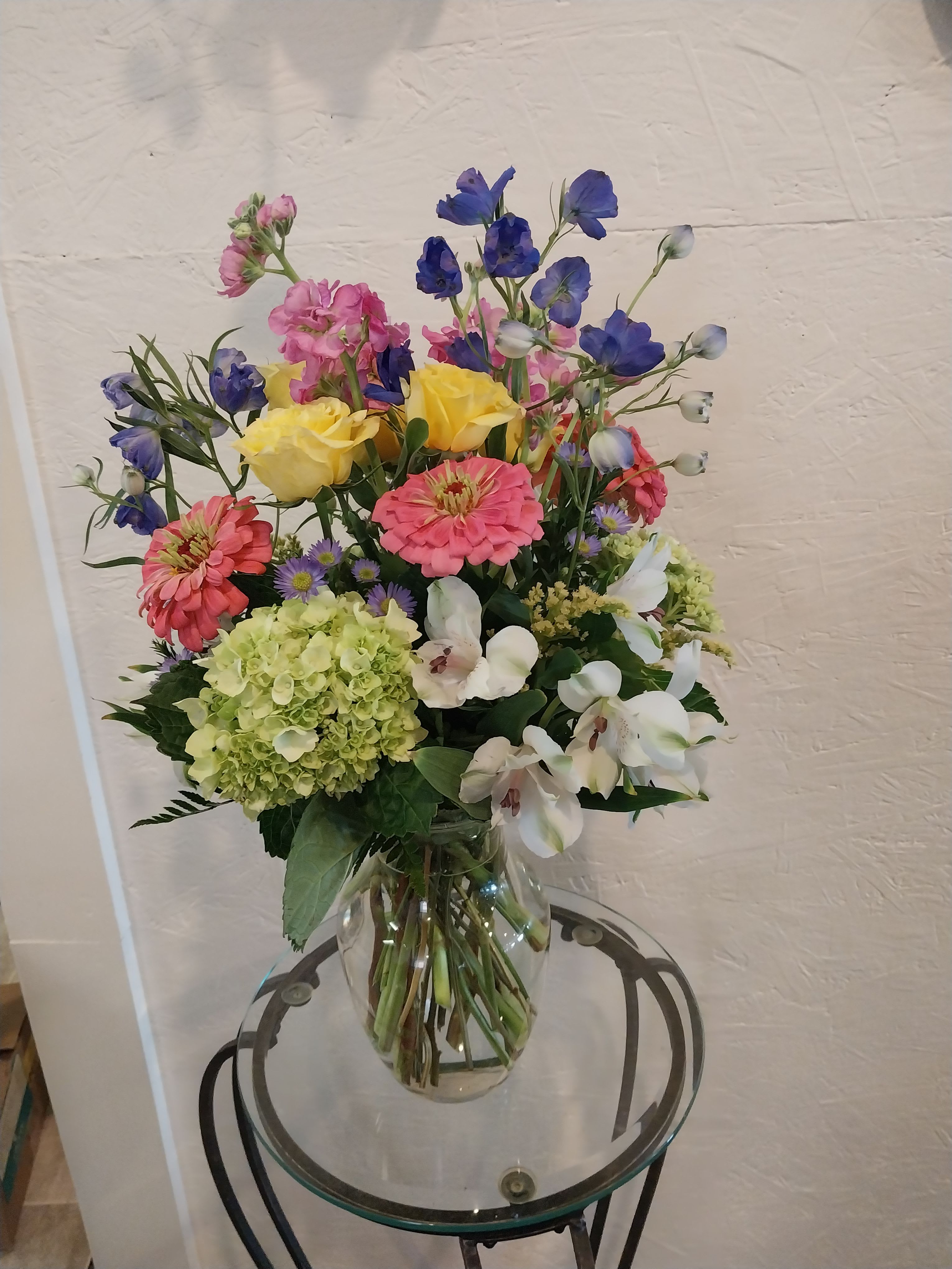 Summer Mist  - Pastel Stock Gerbarea Daisies Yellow Spray Roses Greeen Hydrangera Blue Delphinium White Peruvian Lilies 