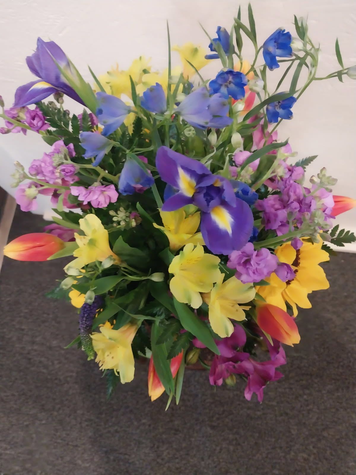 Garden Party  - Iris Sunflowers Blue Delphinium Lavender Stocks Yellow Peruvian Lilies And Purple Peruvian Lilies 