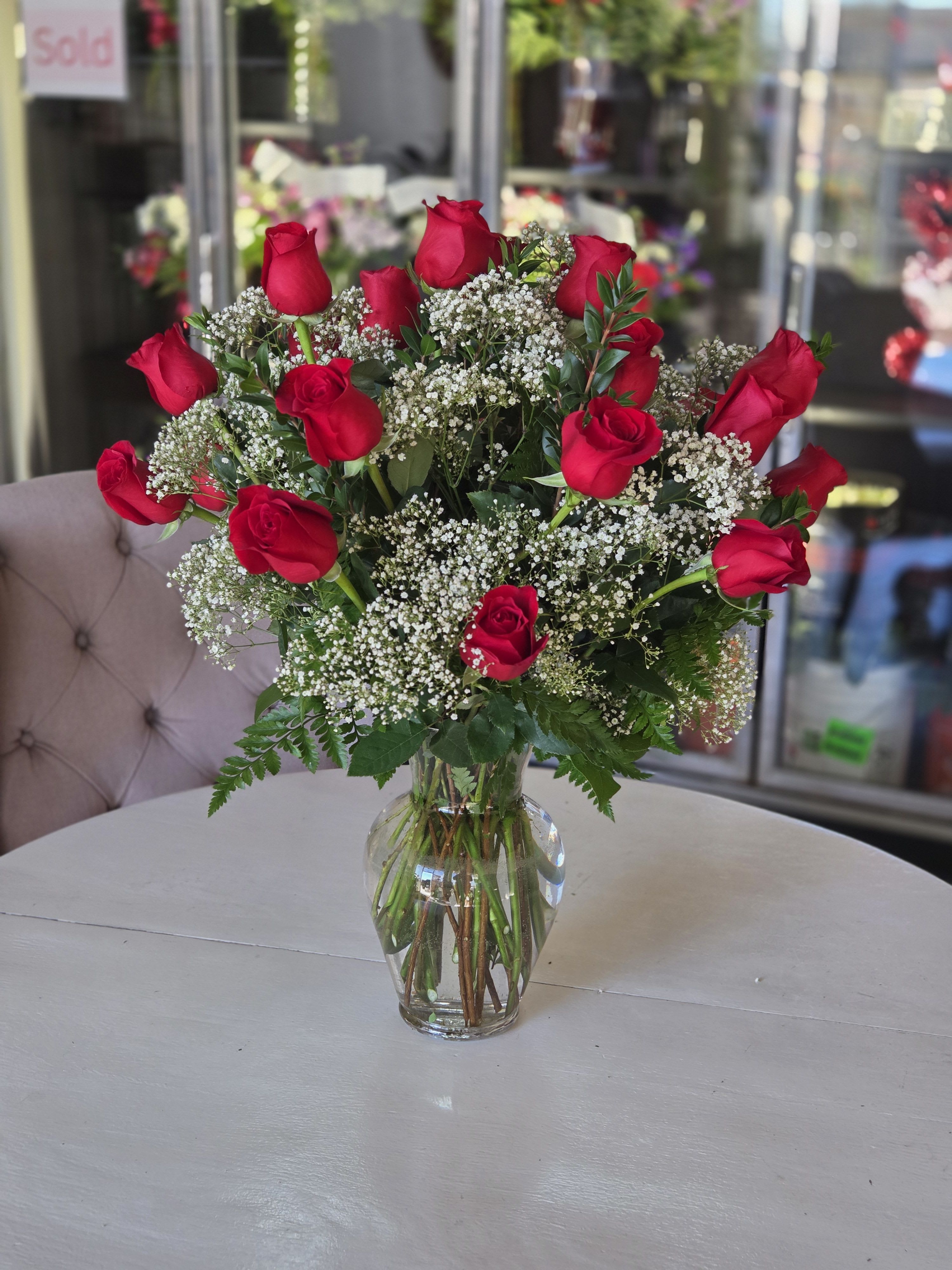 Two Dozen Long Stemmed Red Roses by BloomNation™ - These two dozen red roses provides the classic romantic gift. It's perfect for Valentine's Day or an Anniversary. APPROXIMATE DIMENSIONS: 30" H X 22" W