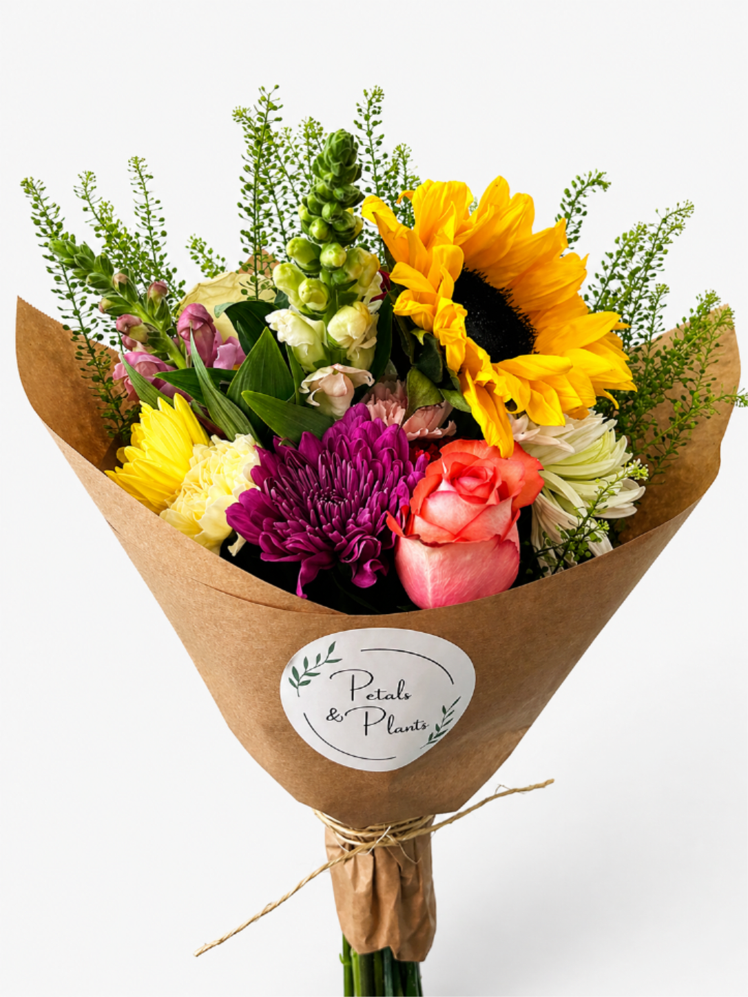 Kraft Paper wrapped Bouquet - Our Designer’s Choice bouquet features a fresh, hand-selected assortment of seasonal blooms, thoughtfully arranged for a beautiful and balanced presentation. Each arrangement is unique and changes regularly based on what’s in season and at its best. Wrapped in natural kraft paper for a simple, modern look, this bouquet is ready for gifting or enjoying at home. Please note, this arrangement does not include a vase.