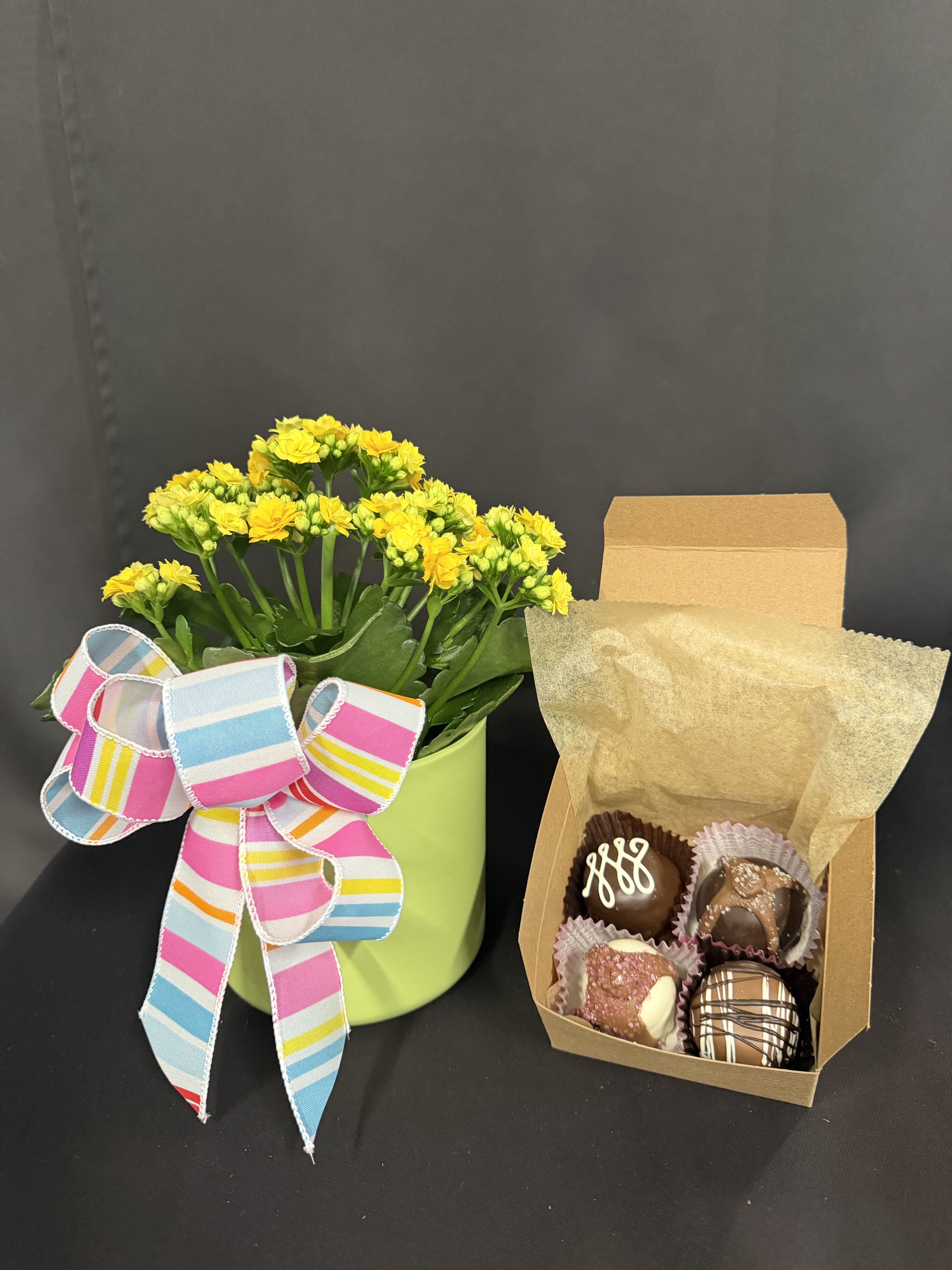 Mother's Day Blooming Bundle - No need to shop anywhere else! This gift set has everything you need for the perfect Mother's Day gift! Modest size set includes a charming kalanchoe plant, an adorable flight of 5 gourmet Sweet Shop USA truffles, and a fragrant 3 oz. "Mama Bear" Ella B candle (coconut, wood bark &amp; amber scent).   Classic size includes everything above but the candle size upgrades to a larger 11 oz.  "Mama Bear" candle.  Lavish size includes everything with the larger candle and a beautiful, hand embroidered tea towel. All tea towels are different so the color &amp; pattern will vary.  ***PLEASE NOTE: Kalanchoe is 4" diameter in size and COLOR MAY VARY***