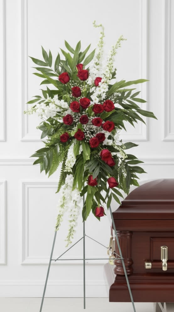 Red Standing Easel - Tall standing spray of clustered red roses with white fillers, lush green foliage on a metal easel