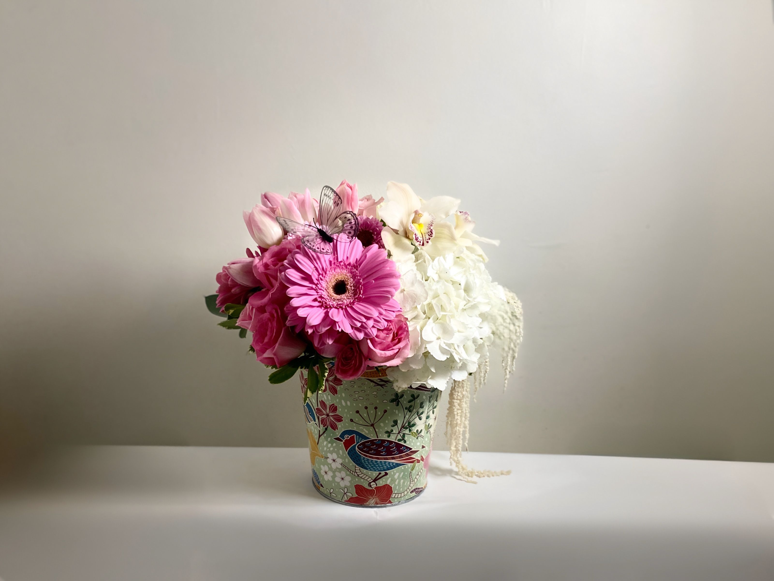 Garden of Grace by Indy Joy Blooms - Celebrate the woman who does it all with a lush, garden-inspired medley. This arrangement features velvety pinks and delicate white, symbolizing the warmth and unconditional love only a mother can give. Finished with seasonal greenery. Its a timeless way to say "I love you.