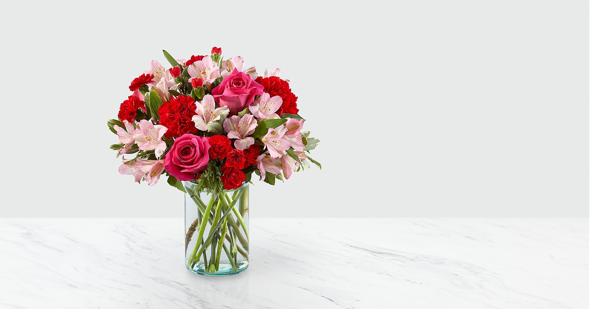 Precious Pink Bouquet - Blushing shades of pink blooms are nestled in lush greens to charm anyone's day. This bouquet is abundant with a classic assortment of pretty florals – roses, alstroemeria and carnations to name a few. GOOD bouquet includes 11 stems. Approximately 15"H x 11"W. BETTER bouquet includes 15 stems. Approximately 16"H x 12"W. BEST bouquet includes 19 stems. Approximately 17"H x 13"W. Your purchase includes a complimentary personalized gift message.