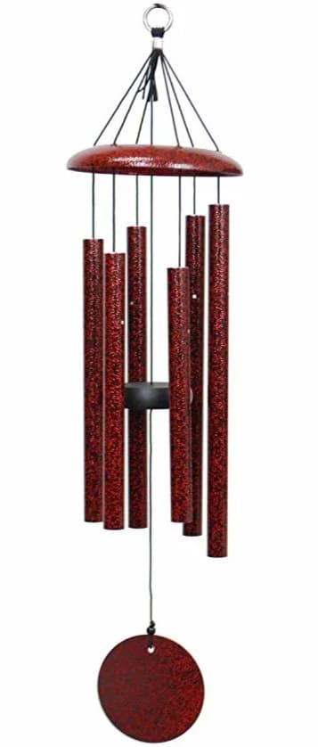 Red metal wind chime with hanging tubes and a round clapper