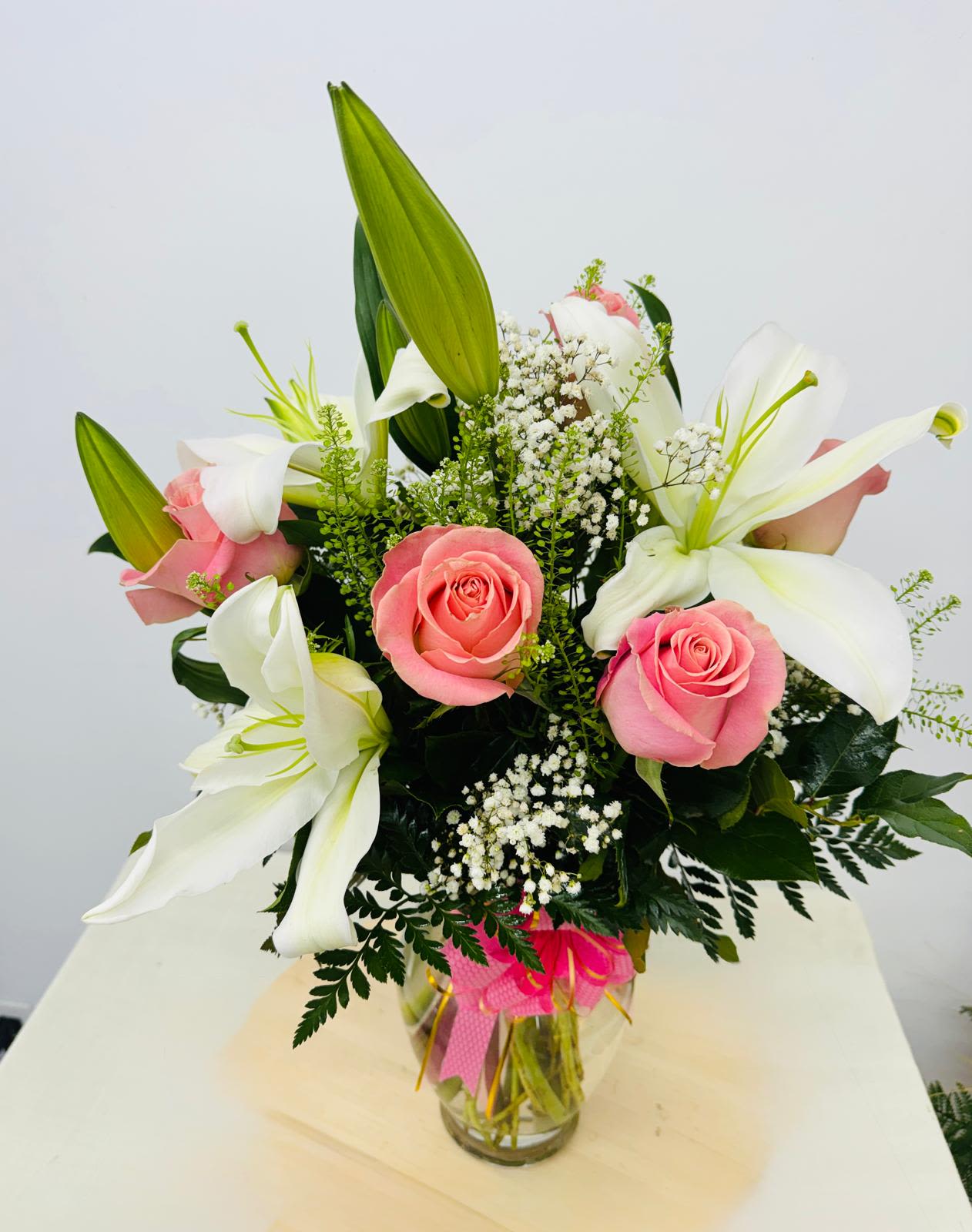 Pink Cloud - Send the relaxing beauty of our Pink Cloud. Beautifully scented Casa Blanca lilies are combined with premium pink Roses in a classic  vase. A delicate and memorable design.  Displays perfectly at the office of home 