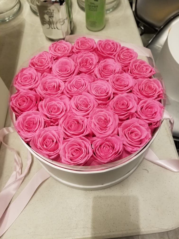 With Love - 27 beautiful pink preserved roses (real) lasting at least two years with no maintenance. Presented in a beautiful round box with top and ribbon.