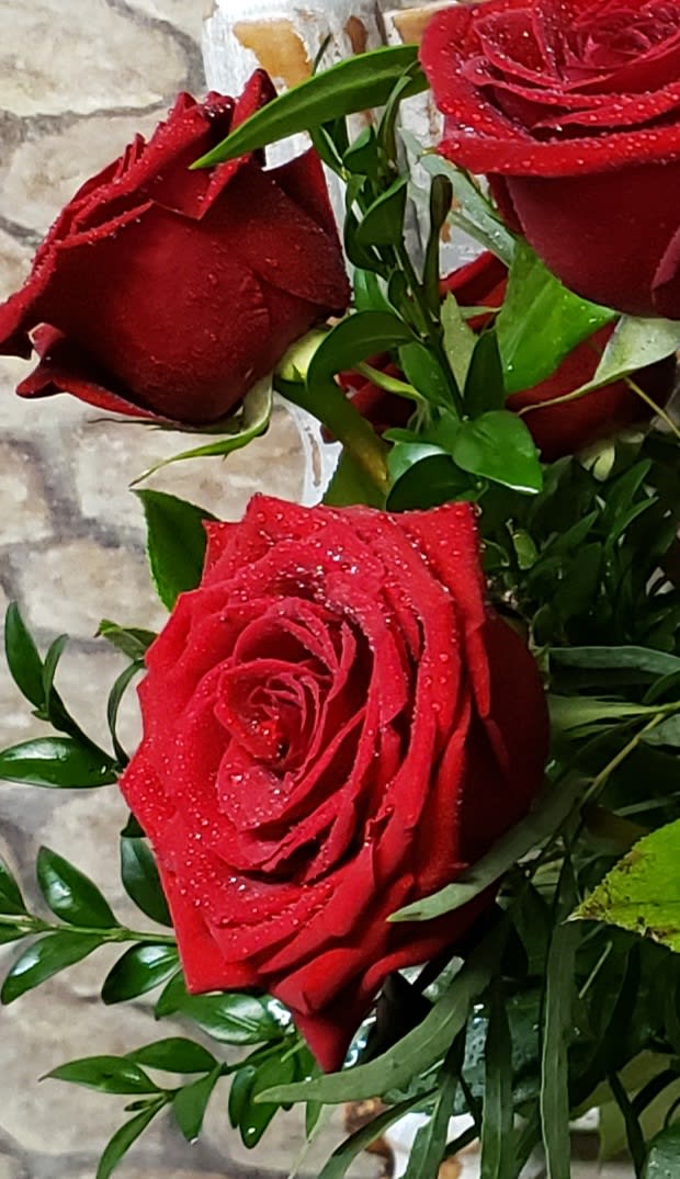 A Very Rosy Mom - NO VASE ITEM!  Has Fresh cut flower variety and a few Roses, (not a dozen) red or colored Roses in this WRAPPED FLOWER BOUQUET. NO VASE!! Holiday weeks will have market prices for this choice.  While supplies last!  Other colors may be, pink, white, fushia, novelty bi-color, too! 