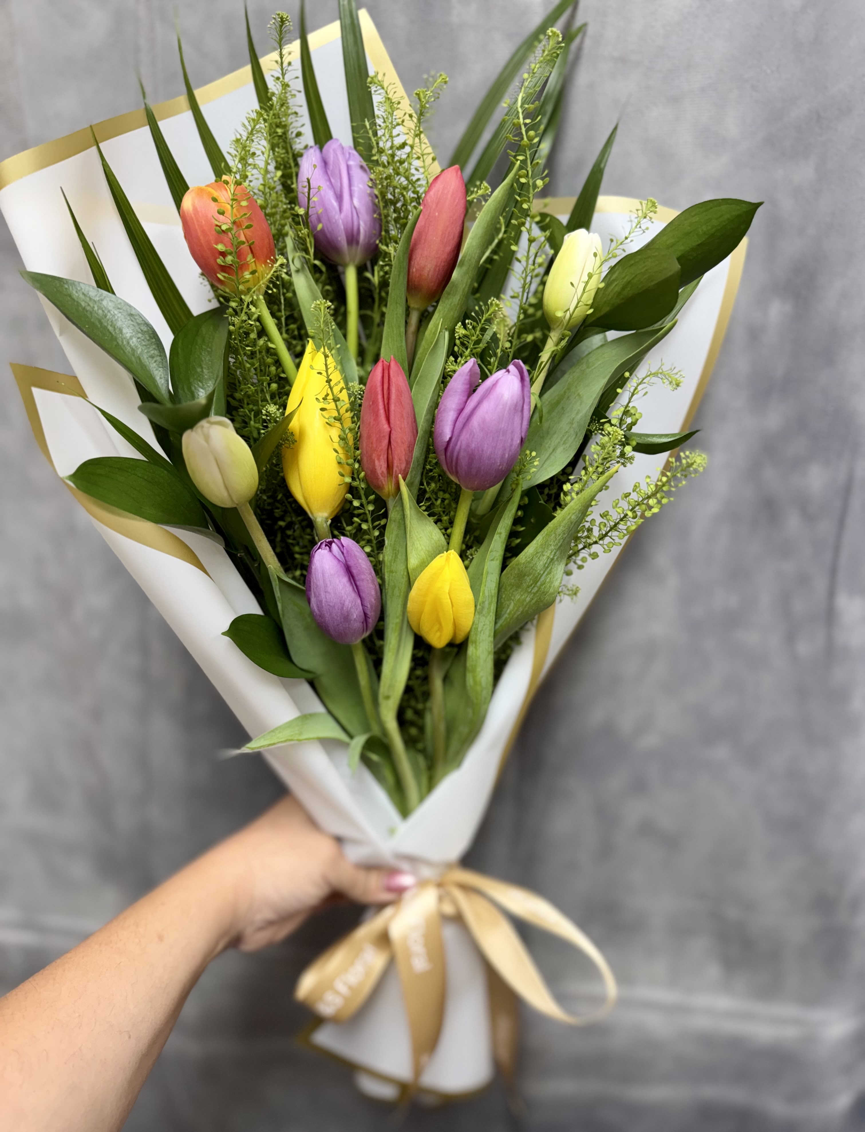 Tulips bouquet  - A stunning bouquet of fresh vibrant tulips arranged to bring elegance , joy for any occasion.  Flowers colors varies depending on availability.