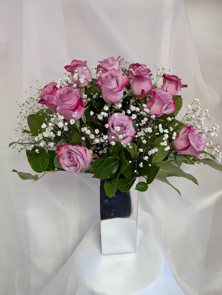 1 Dozen Deep Purple Roses (Mother's Day Edition) - 12 Deep purple roses complimented by baby's breath and foliage.